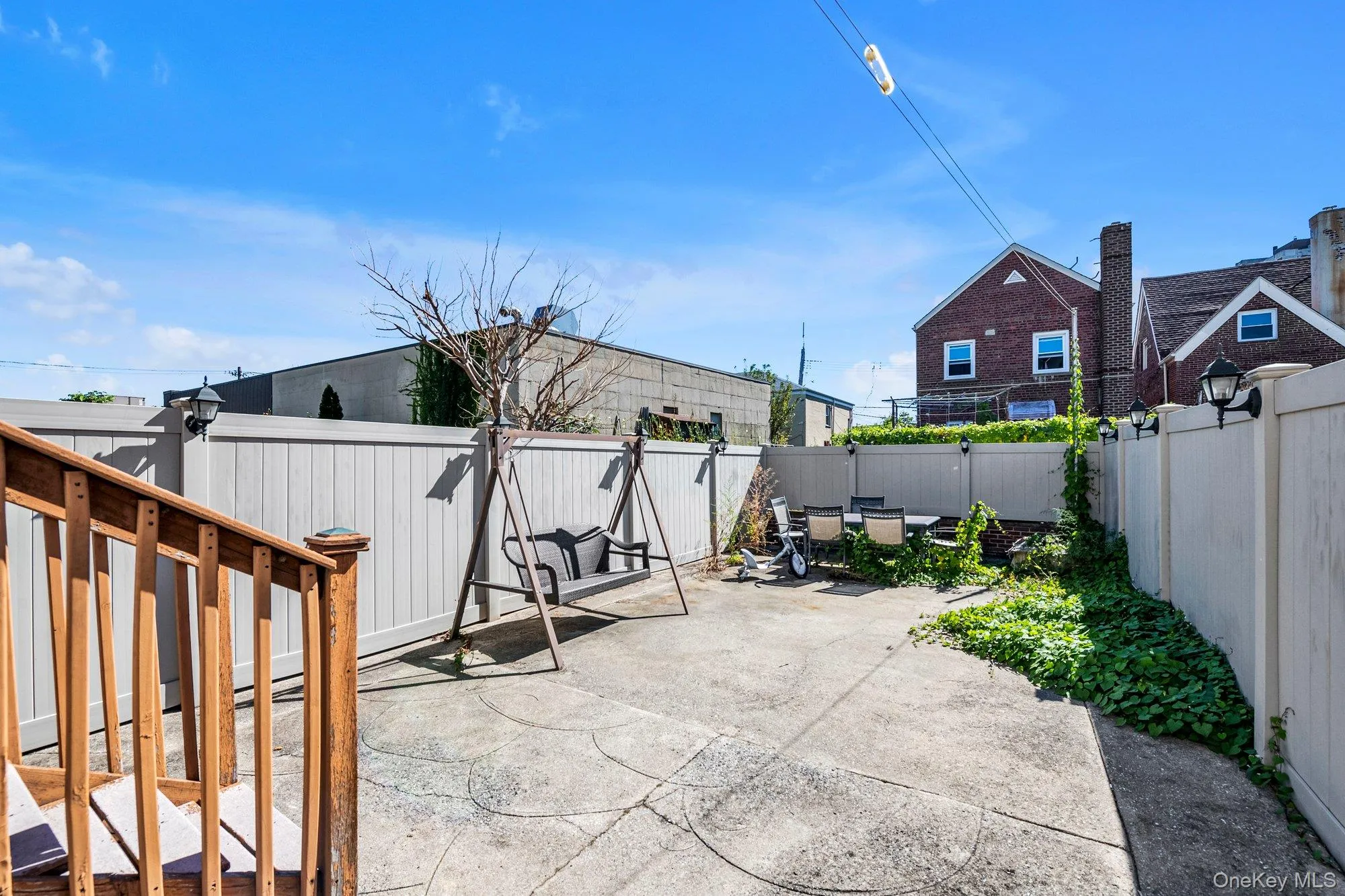 Fenced backyard featuring a patio and outdoor dining area Fenced backyard featuring a patio and outdoor dining area
