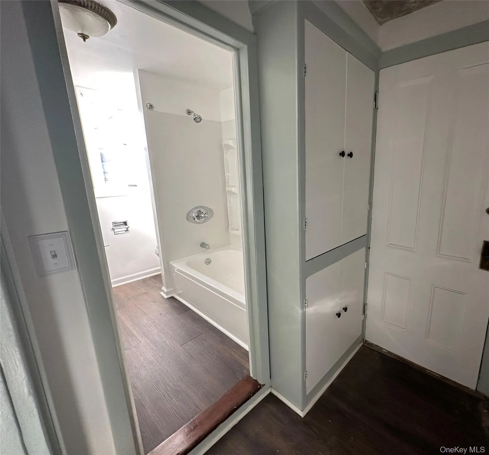 Storage area with large closets outside of bathroom Storage area with large closets outside of bathroom