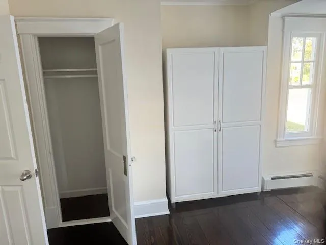 Closet featuring baseboard heating Closet featuring baseboard heating