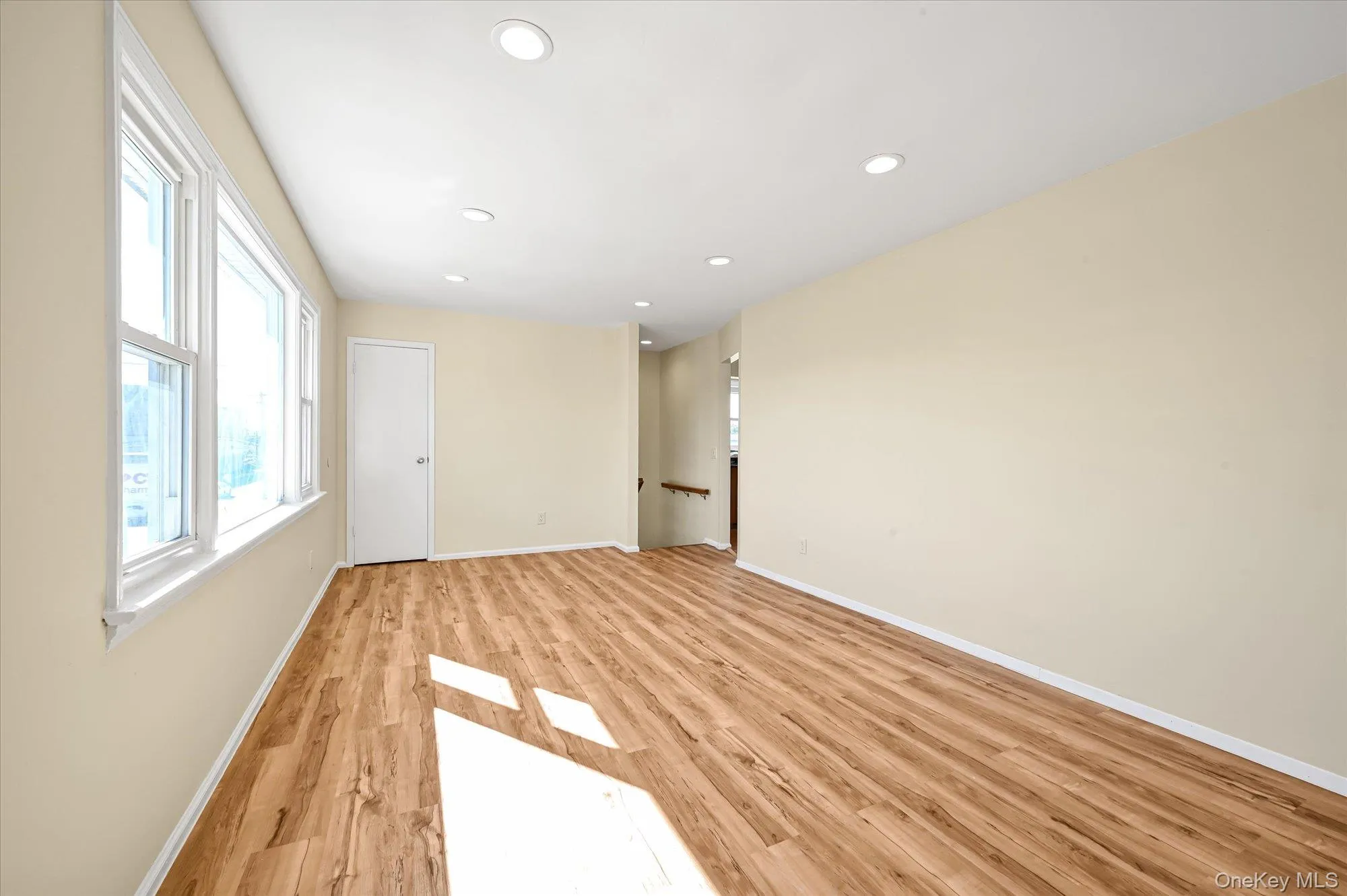 Empty room with recessed lighting and light wood-style flooring Empty room with recessed lighting and light wood-style flooring