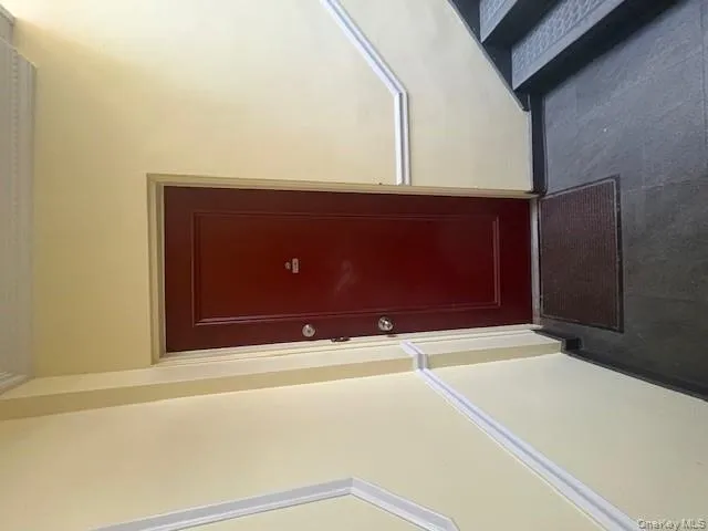 Doorway to property featuring stucco siding Doorway to property featuring stucco siding