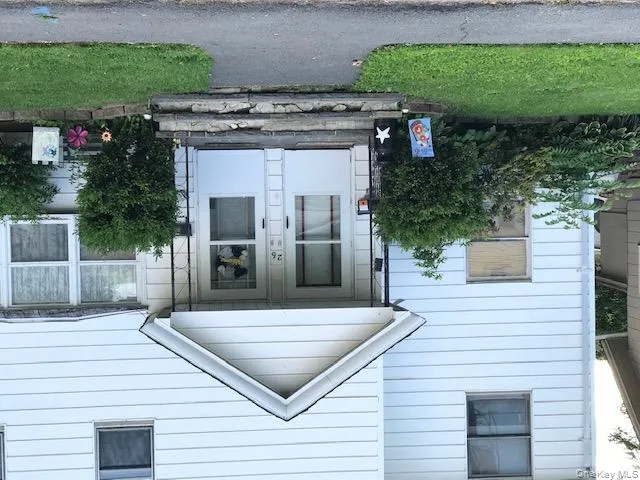 View of exterior entry with covered porch door on left goes to upstairs apt View of exterior entry with covered porch door on left goes to upstairs apt