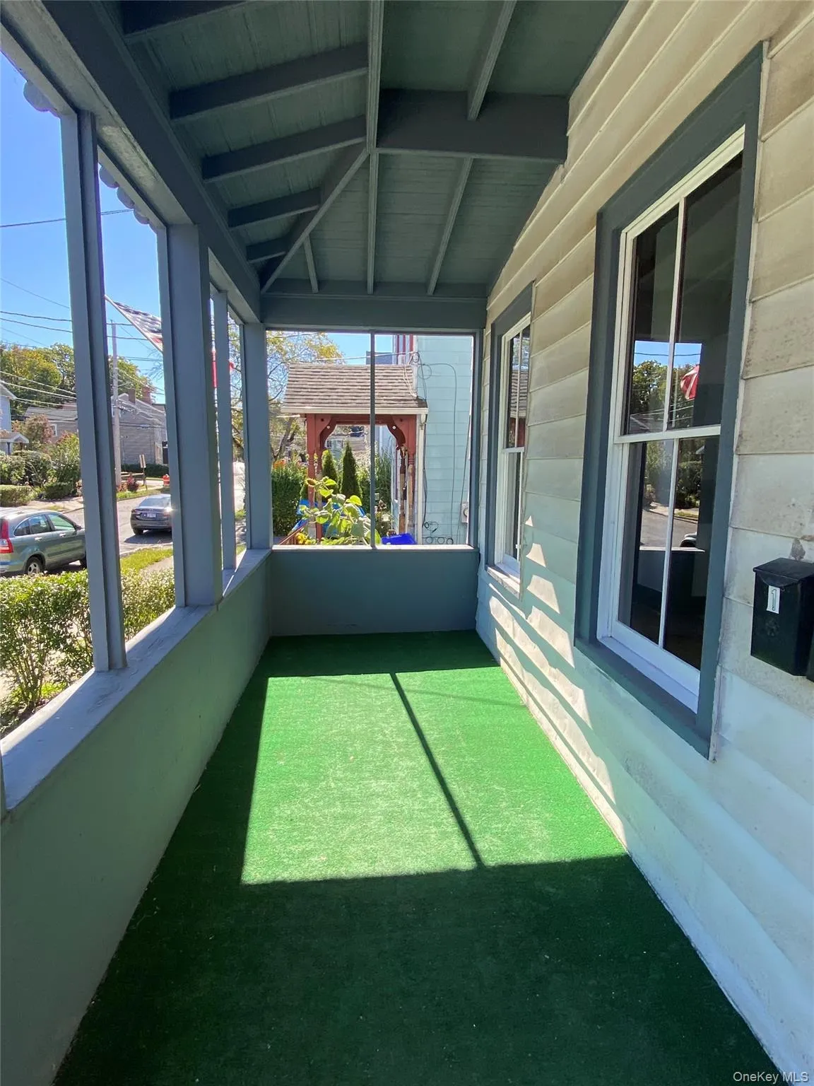 Unfurnished sunroom with plenty of natural light and a porch Unfurnished sunroom with plenty of natural light and a porch