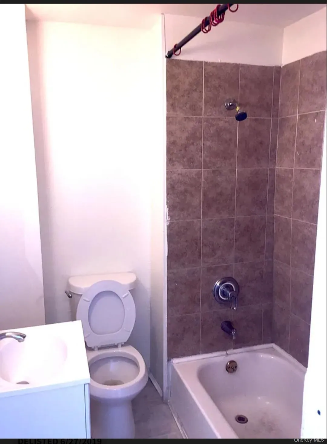 Bathroom with tub / shower combination, vanity, and tile patterned flooring Bathroom with tub / shower combination, vanity, and tile patterned flooring