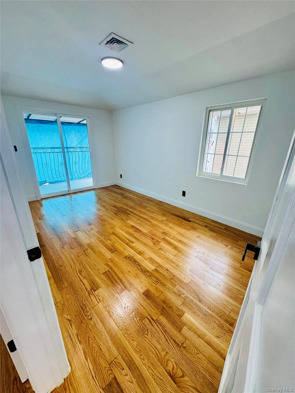 Empty room featuring baseboards and light wood-style floors Empty room featuring baseboards and light wood-style floors