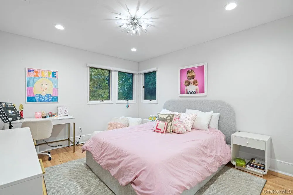 Bedroom featuring light wood-style flooring, recessed lighting, and a desk Bedroom featuring light wood-style flooring, recessed lighting, and a desk