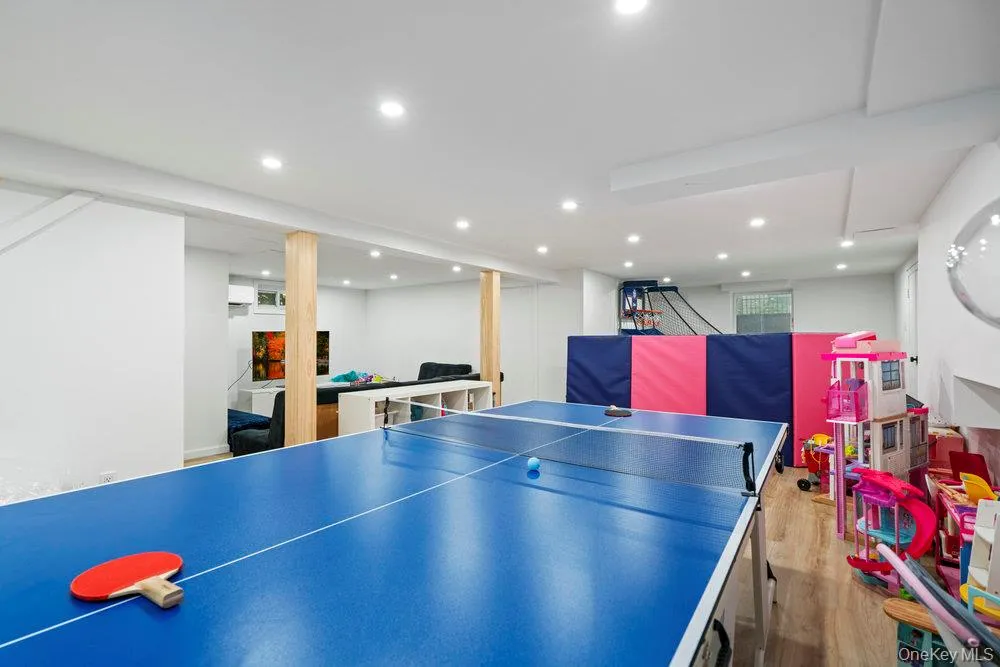 Recreation room featuring light wood-style floors and recessed lighting Recreation room featuring light wood-style floors and recessed lighting