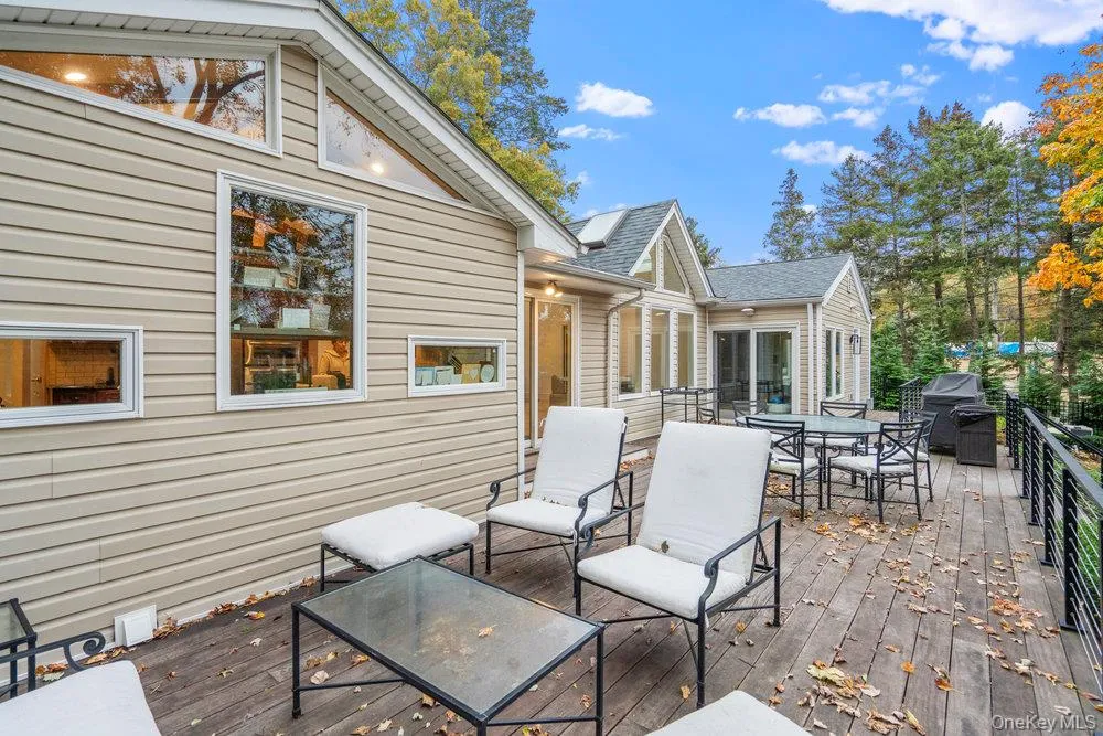 Deck with outdoor dining space and a grill Deck with outdoor dining space and a grill