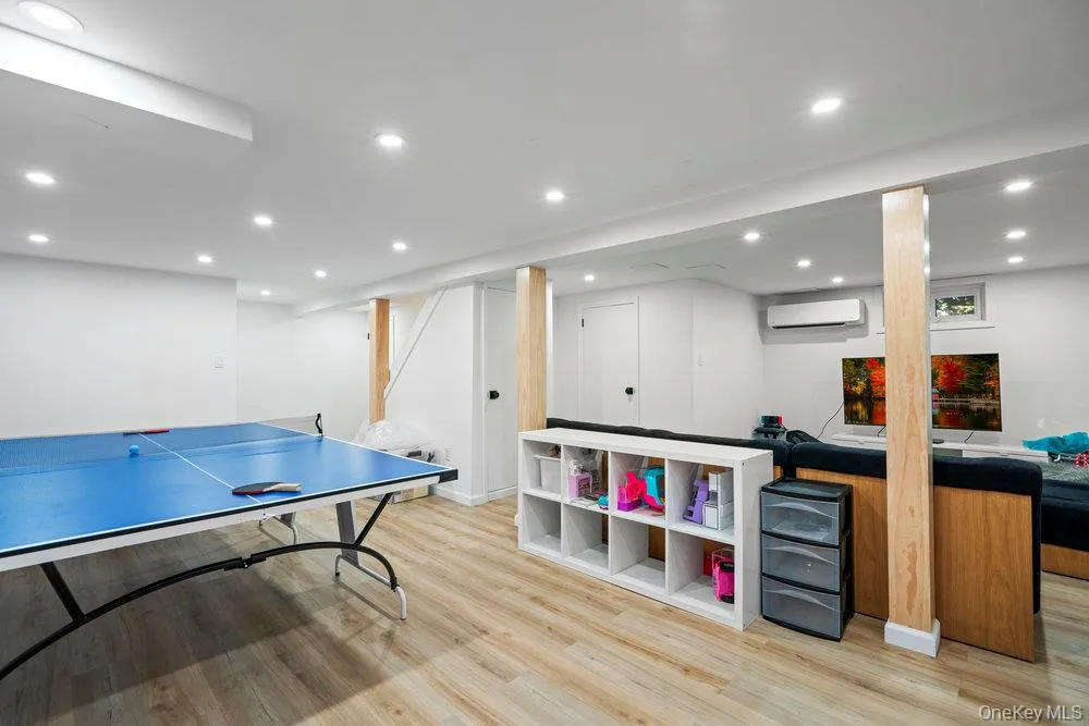 Rec room featuring recessed lighting and light wood-style floors Rec room featuring recessed lighting and light wood-style floors