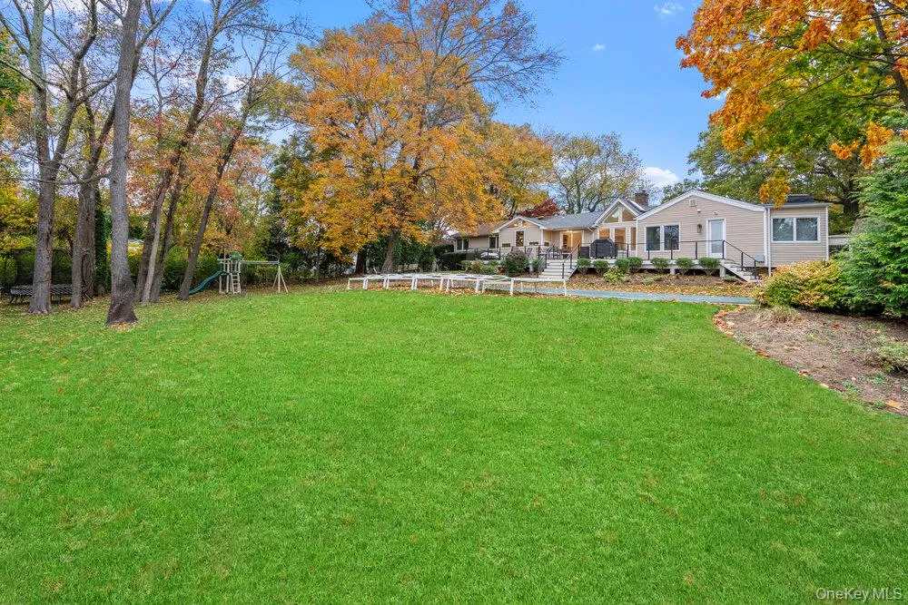 View of grassy yard with a playground View of grassy yard with a playground