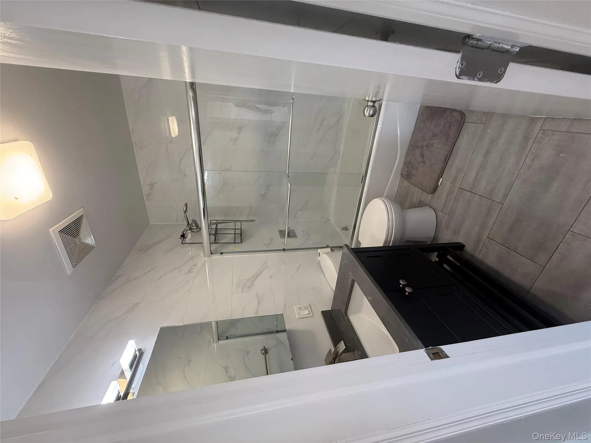 Bathroom with vanity and bath / shower combo with glass door Bathroom with vanity and bath / shower combo with glass door