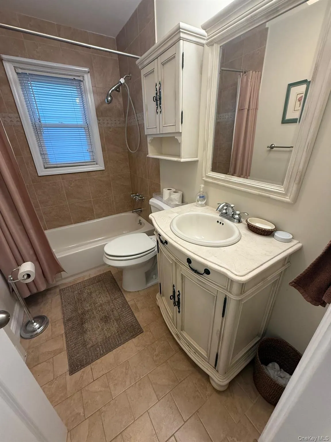 Full bathroom with vanity and shower / bathtub combination with curtain Full bathroom with vanity and shower / bathtub combination with curtain