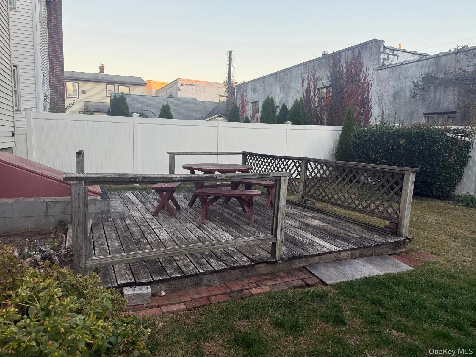 Deck featuring outdoor dining area and a fenced backyard Deck featuring outdoor dining area and a fenced backyard