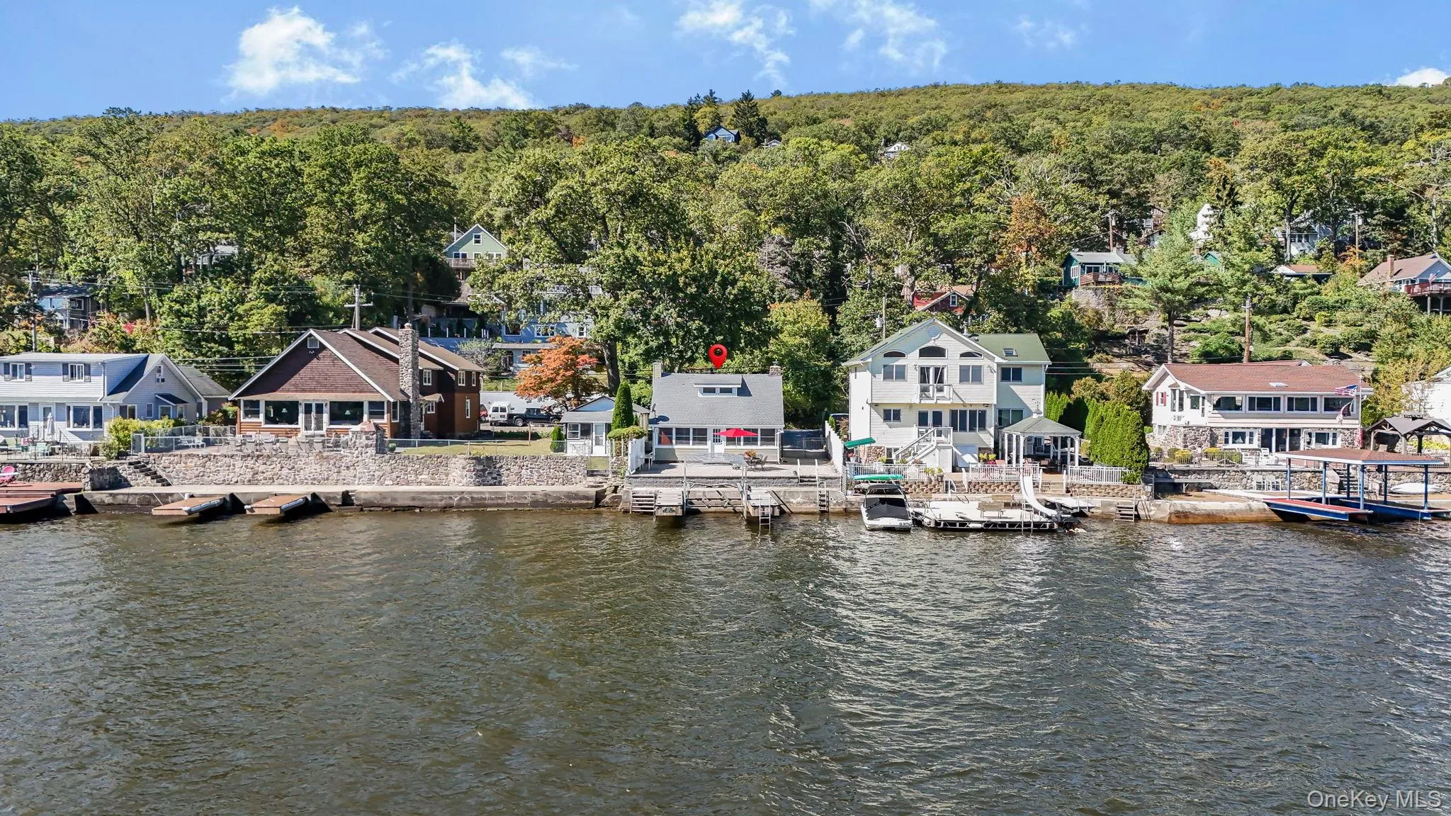 Dock area with a residential view, a water view, and a forest view Dock area with a residential view, a water view, and a forest view
