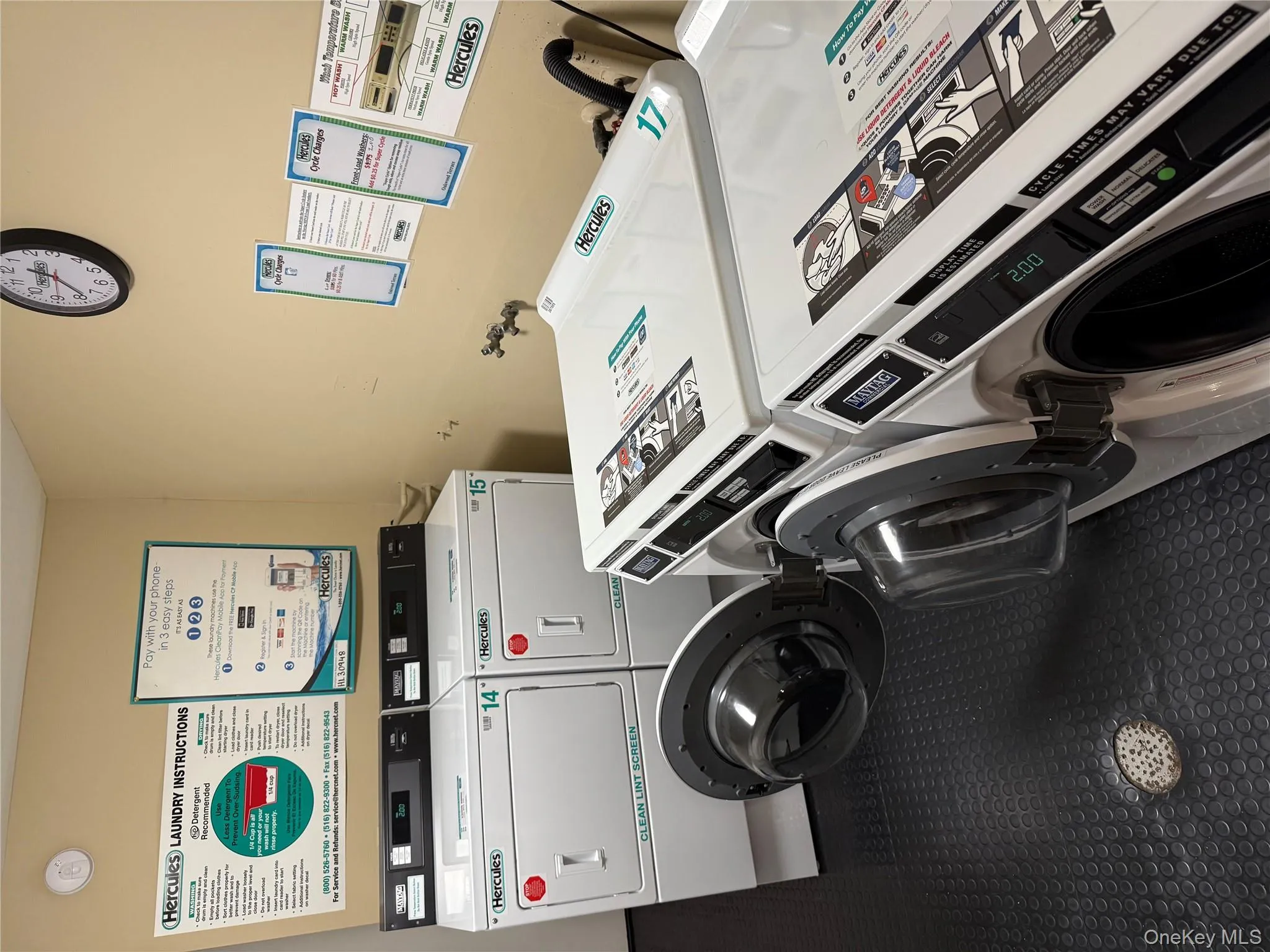 Community laundry featuring washing machine and clothes dryer Community laundry featuring washing machine and clothes dryer