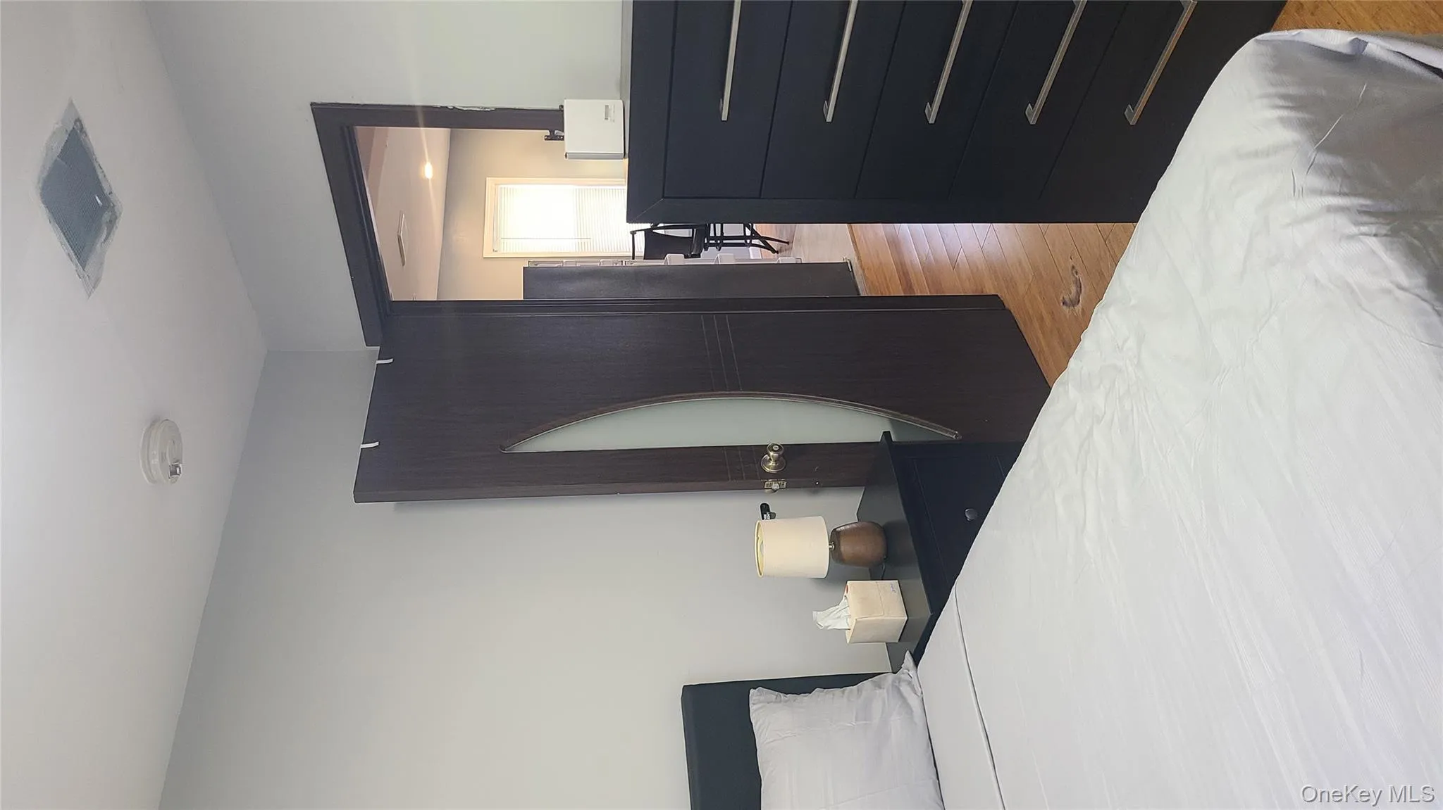 Bedroom with light wood-style flooring Bedroom with light wood-style flooring