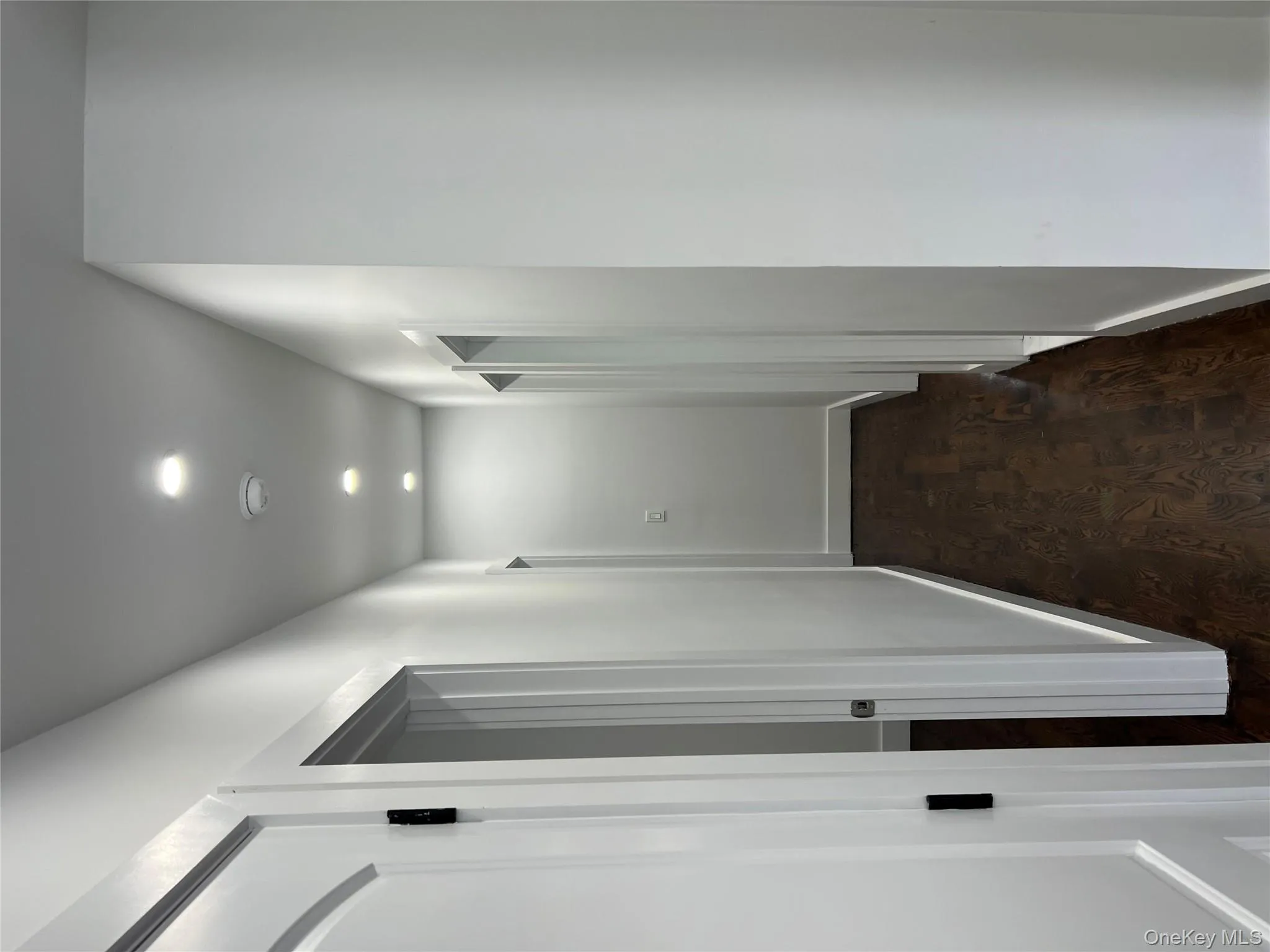 Hallway featuring recessed lighting and dark wood-type flooring Hallway featuring recessed lighting and dark wood-type flooring