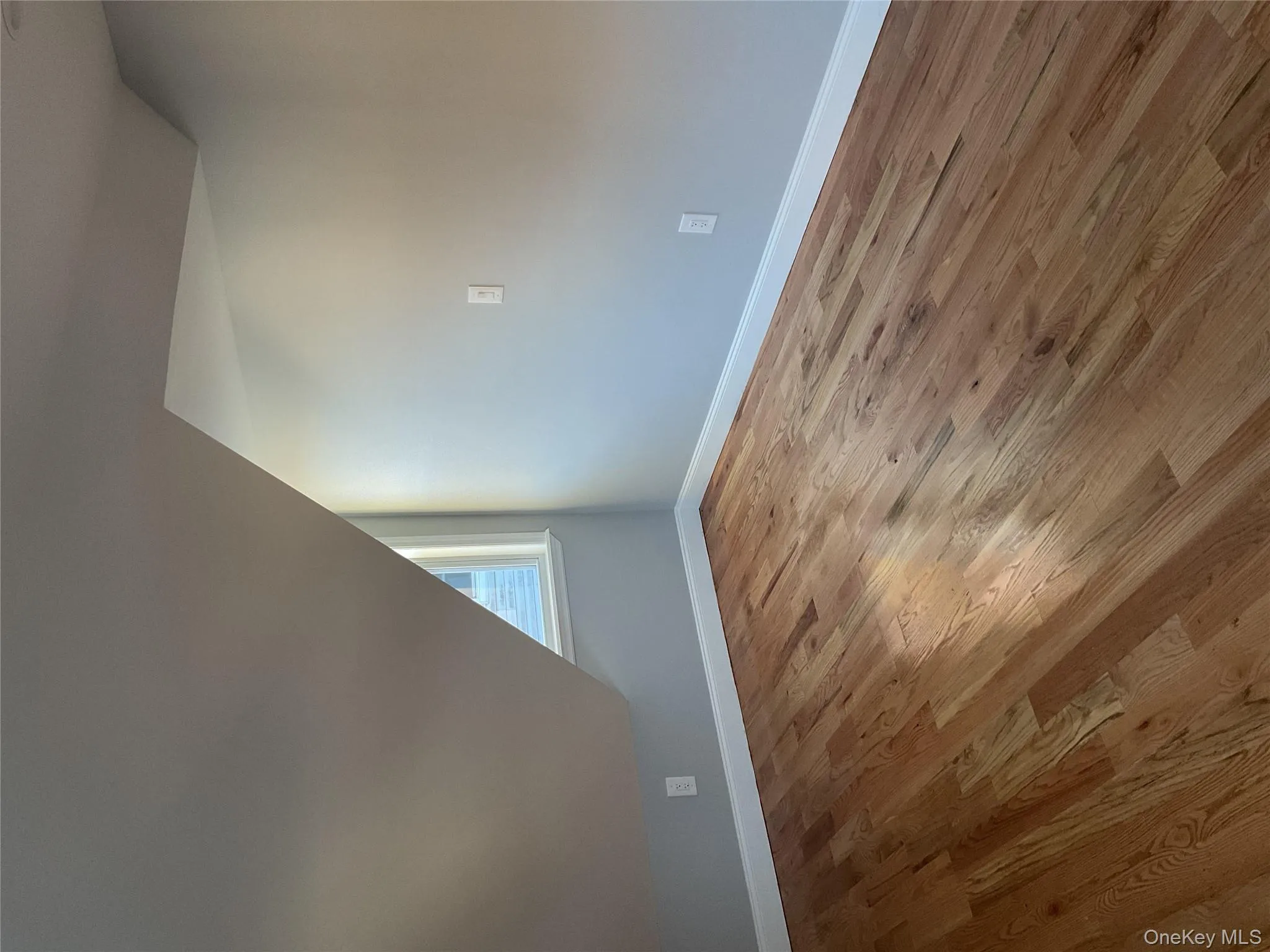 Bonus room featuring vaulted ceiling and wood finished floors Bonus room featuring vaulted ceiling and wood finished floors