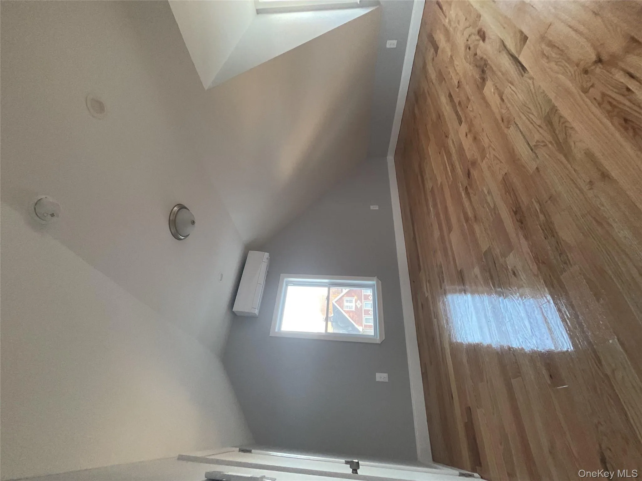 Bonus room featuring vaulted ceiling and light wood-type flooring Bonus room featuring vaulted ceiling and light wood-type flooring