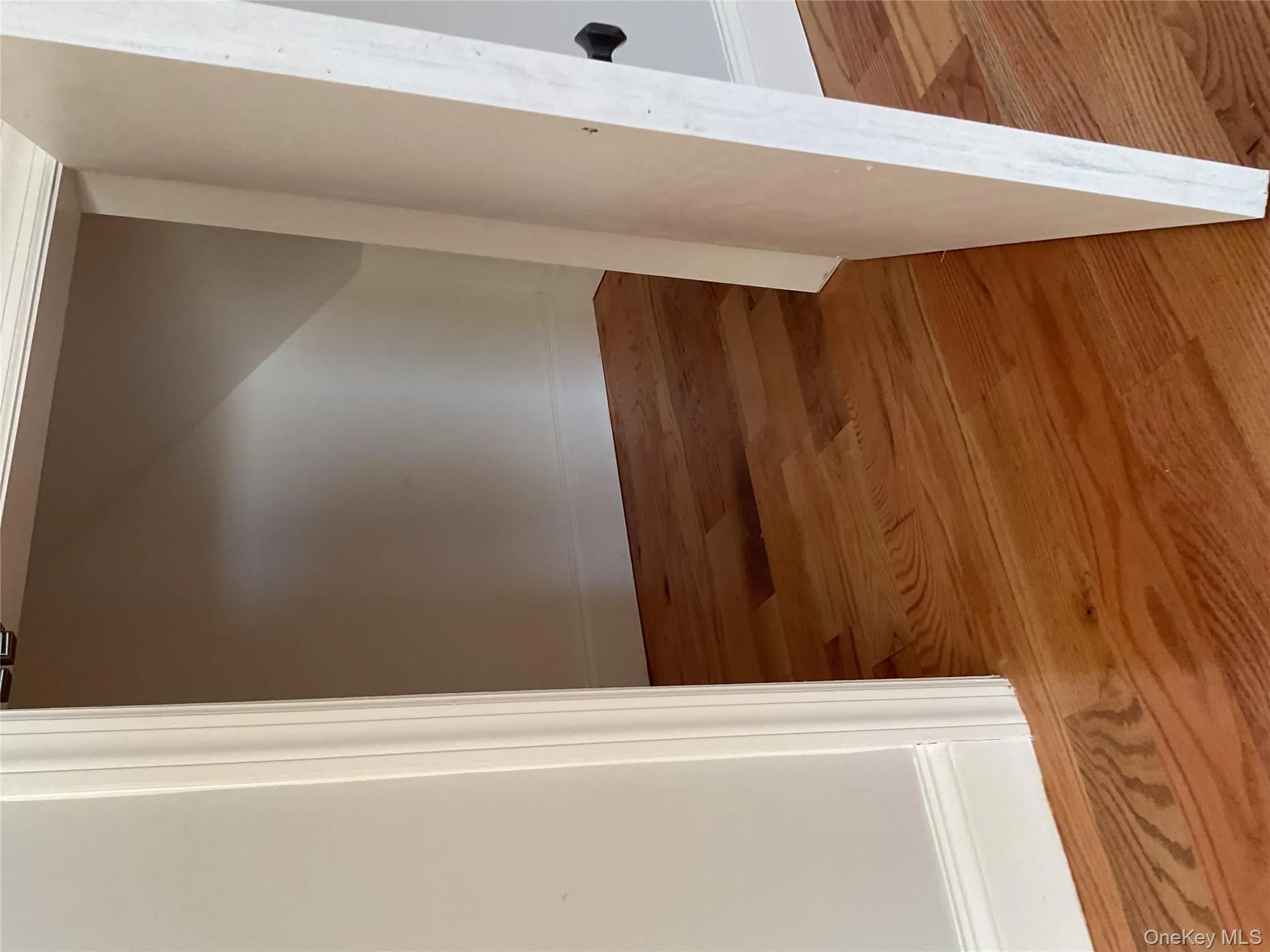 Hall featuring light wood-style floors and baseboards Hall featuring light wood-style floors and baseboards