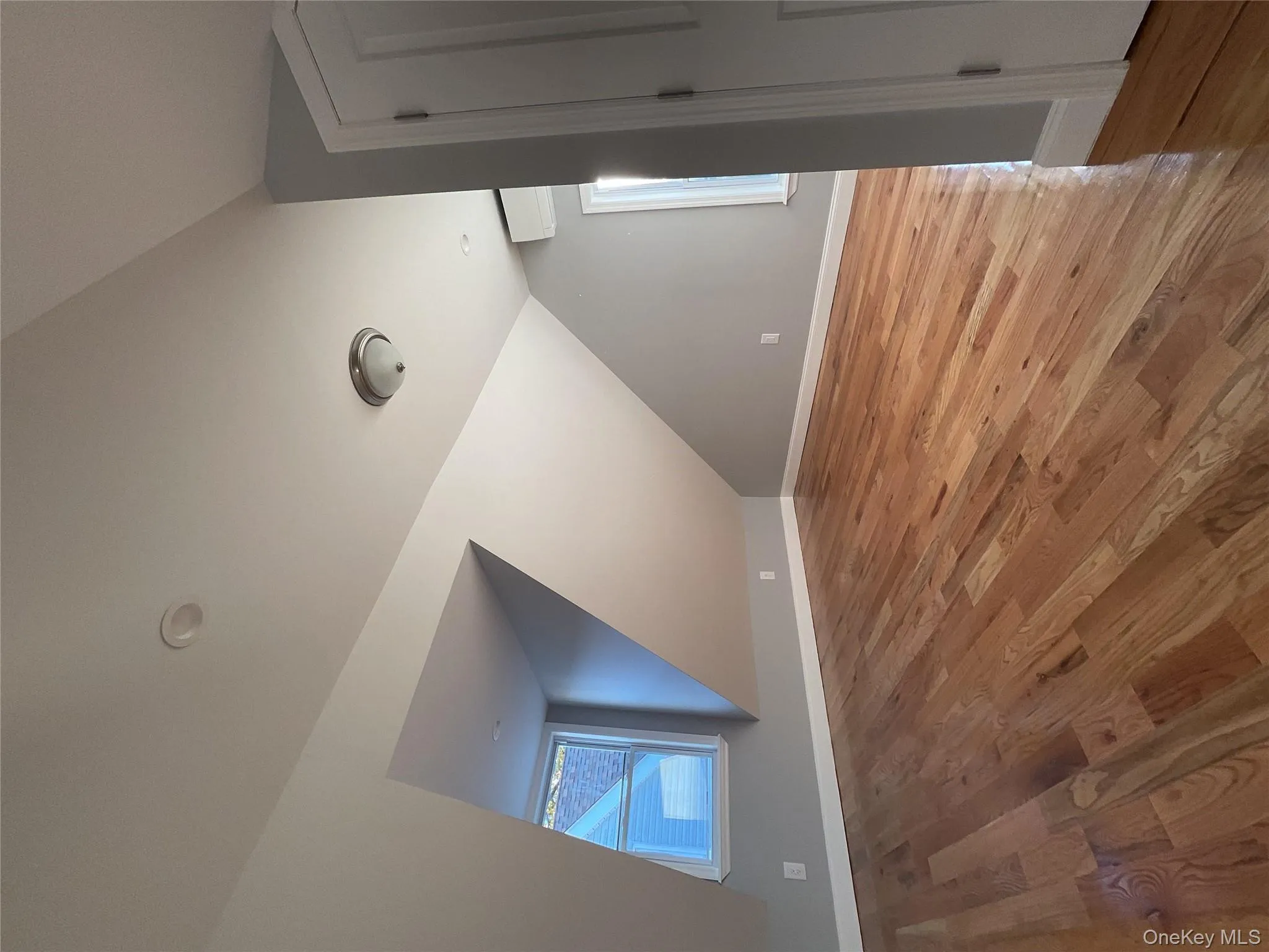 Bonus room featuring vaulted ceiling and light wood-style flooring Bonus room featuring vaulted ceiling and light wood-style flooring