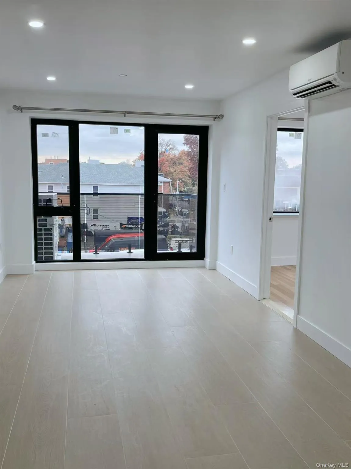 Spare room featuring recessed lighting and an AC wall unit Spare room featuring recessed lighting and an AC wall unit