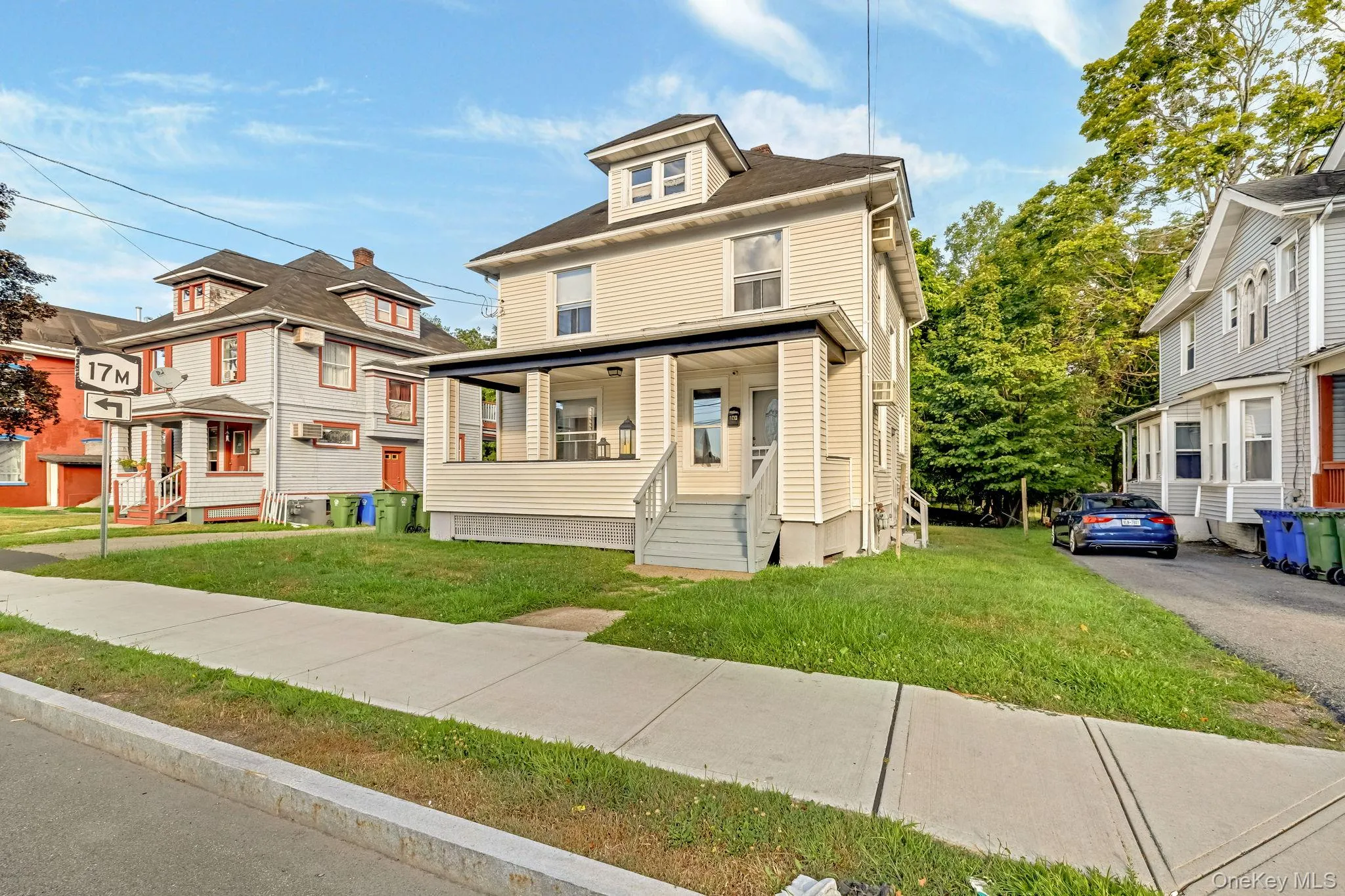 Traditional style home with a front lawn and covered porch Traditional style home with a front lawn and covered porch