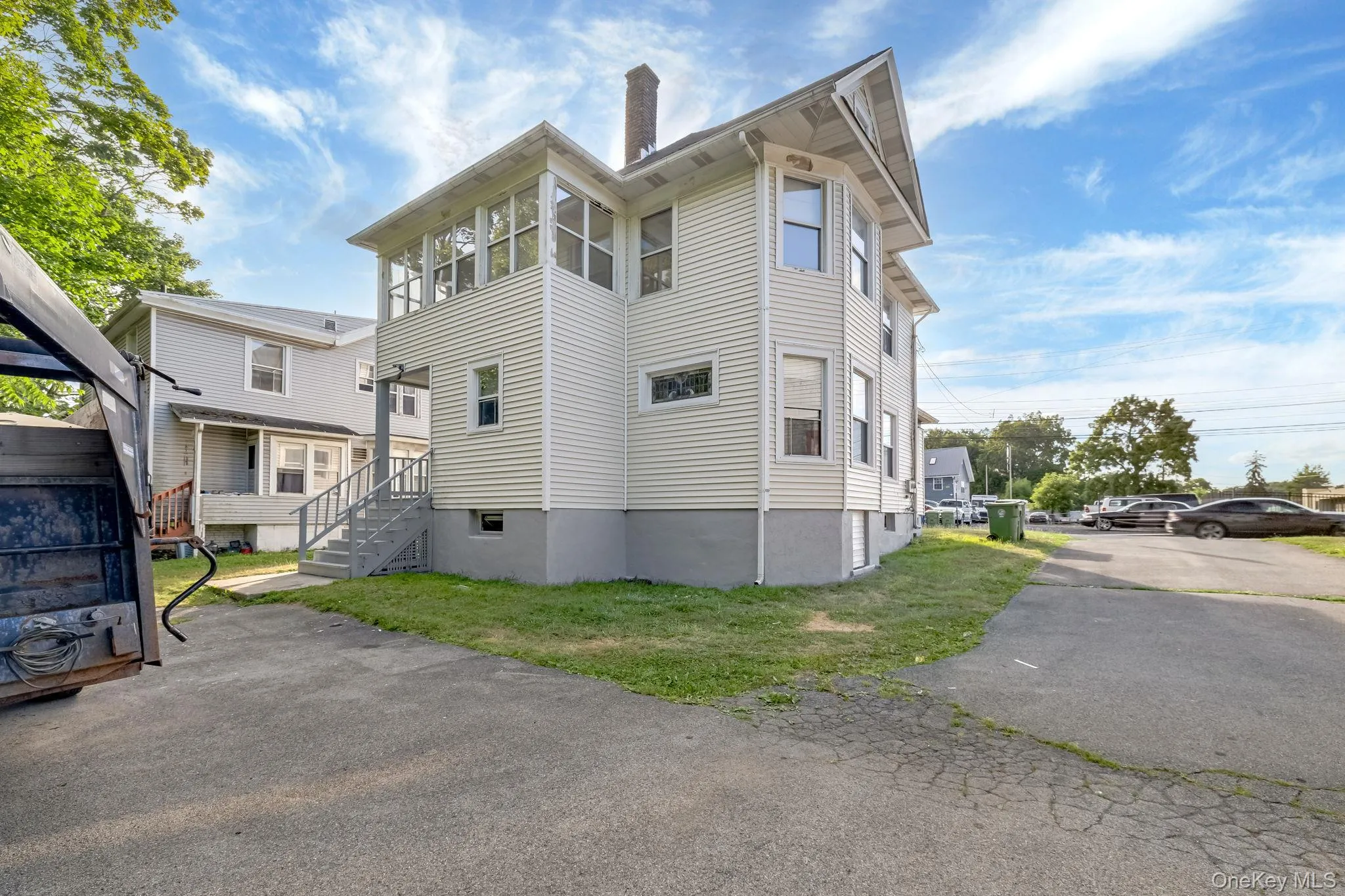 View of property exterior featuring a chimney View of property exterior featuring a chimney