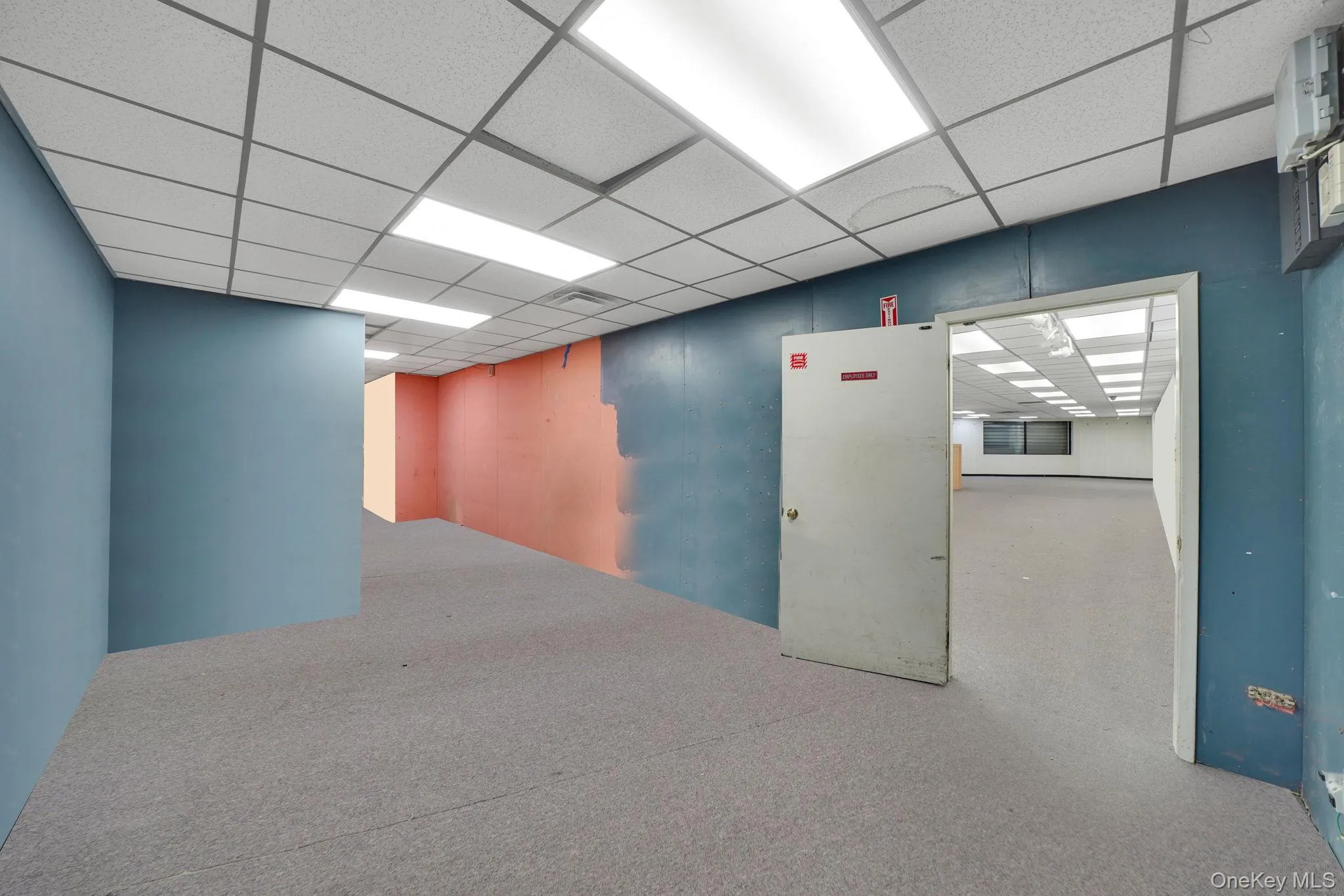 Spare room with a drop ceiling Spare room with a drop ceiling