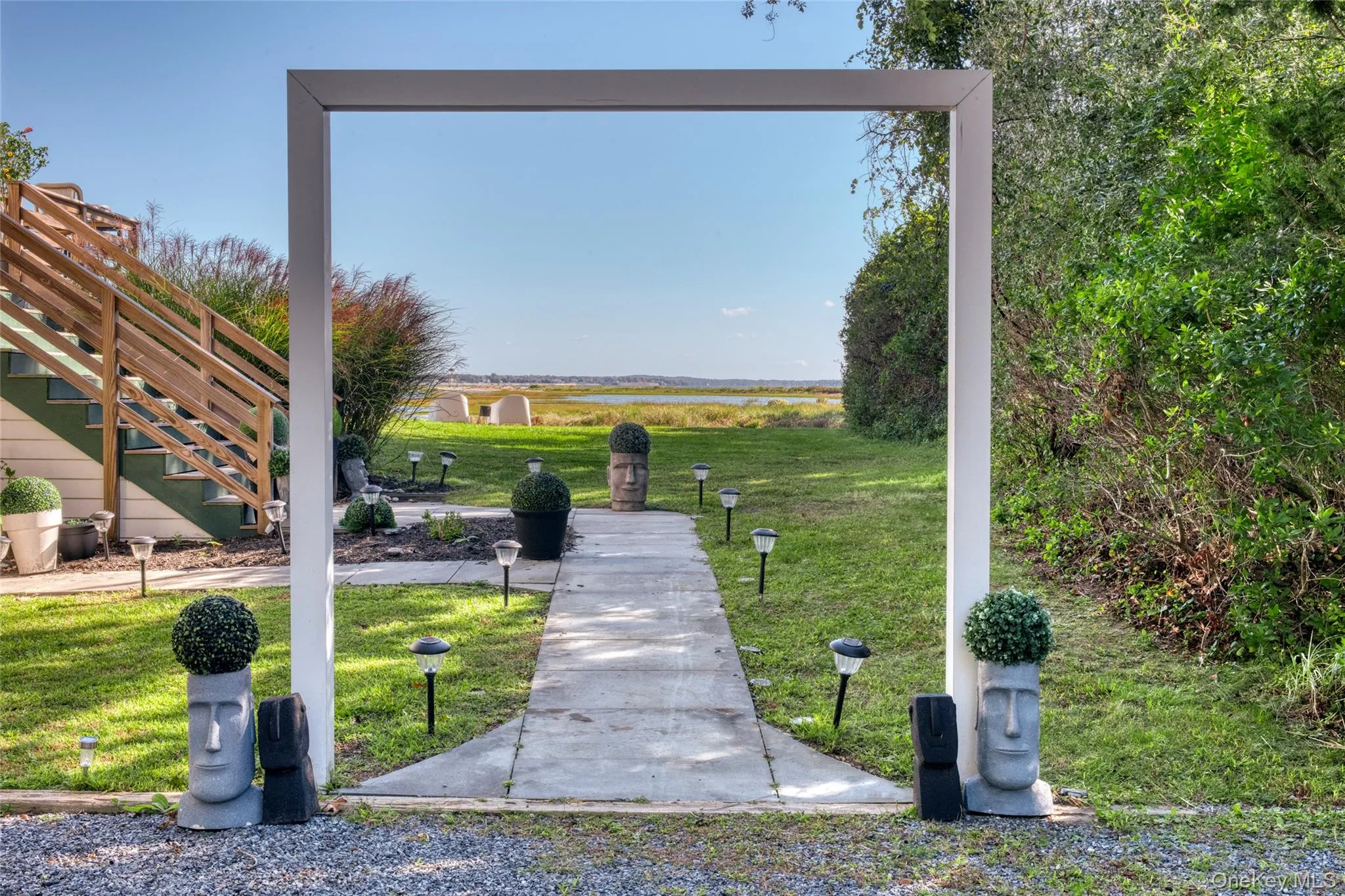 View of home's community featuring stairway and a lawn View of home's community featuring stairway and a lawn
