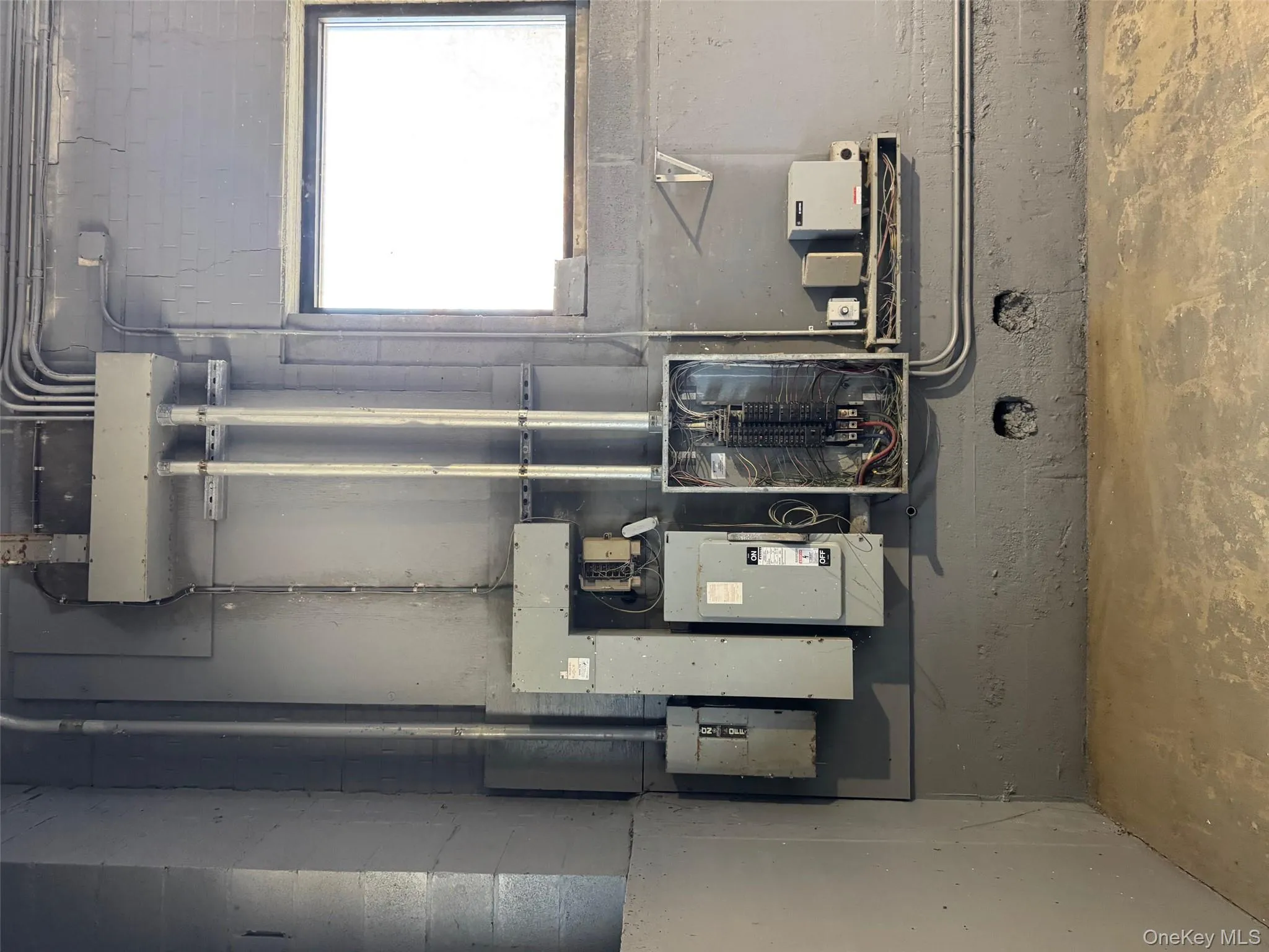 Utility room with electric panel Utility room with electric panel