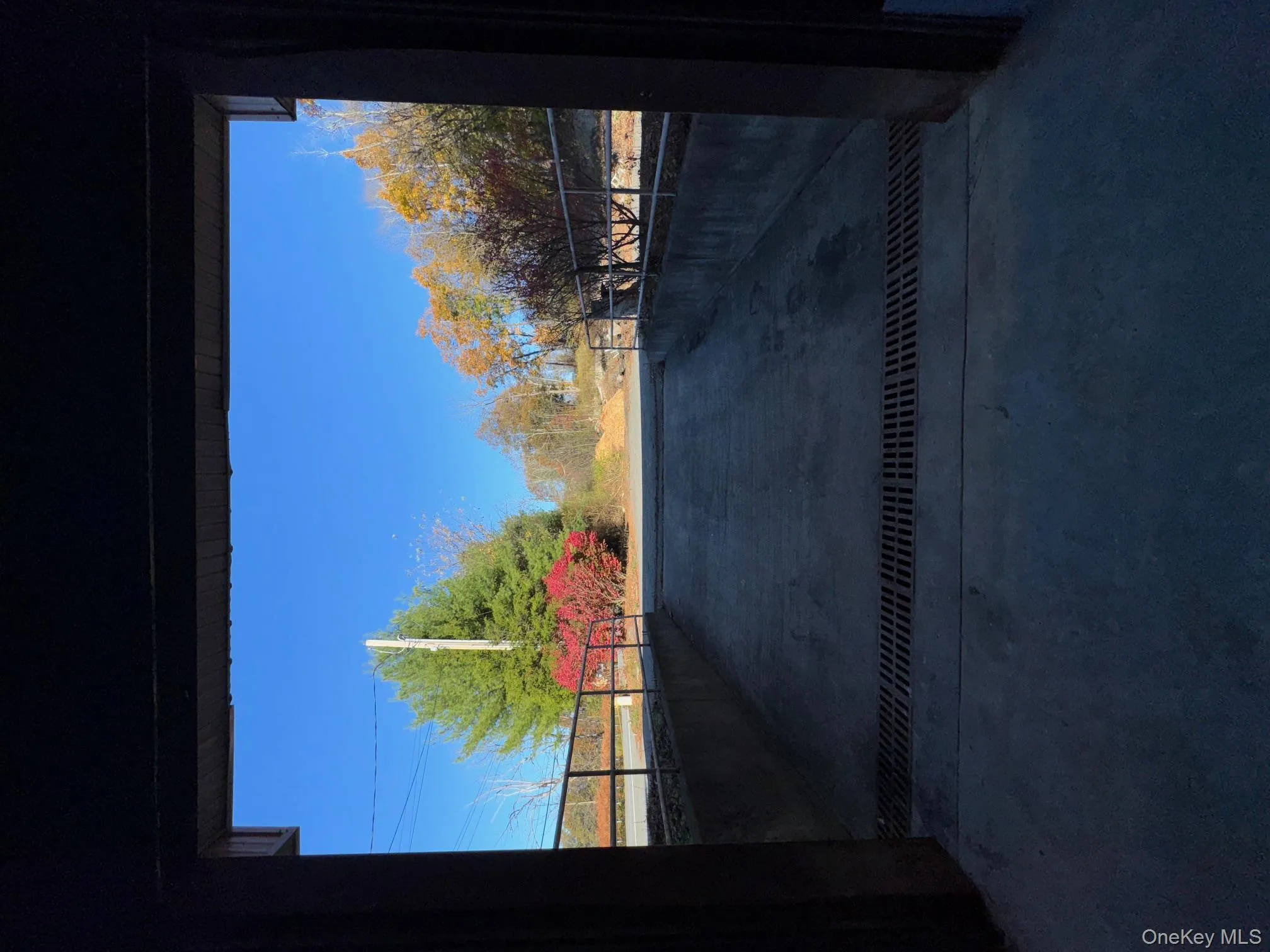 View of patio featuring a gate View of patio featuring a gate