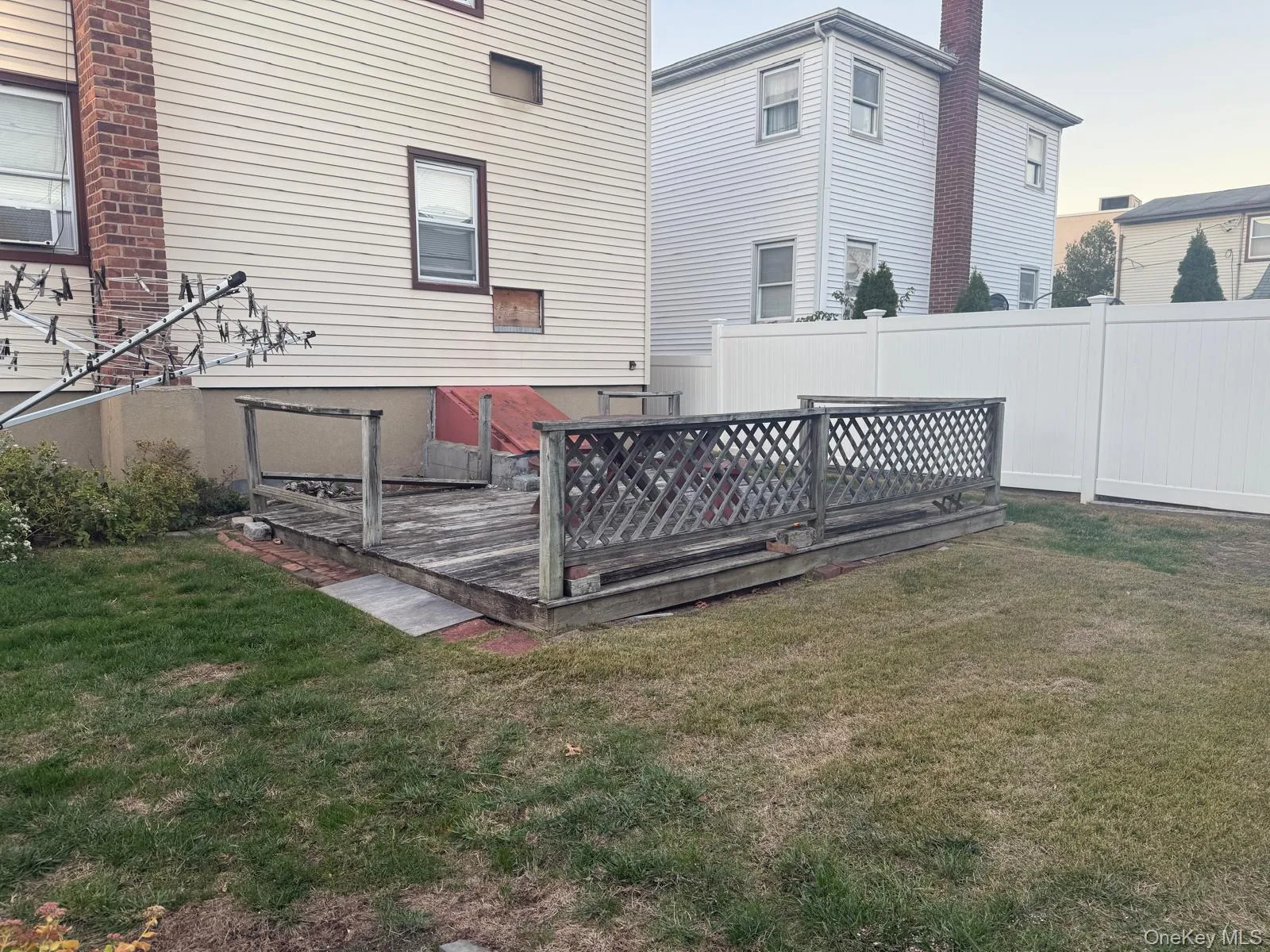 Back of house with a wooden deck Back of house with a wooden deck
