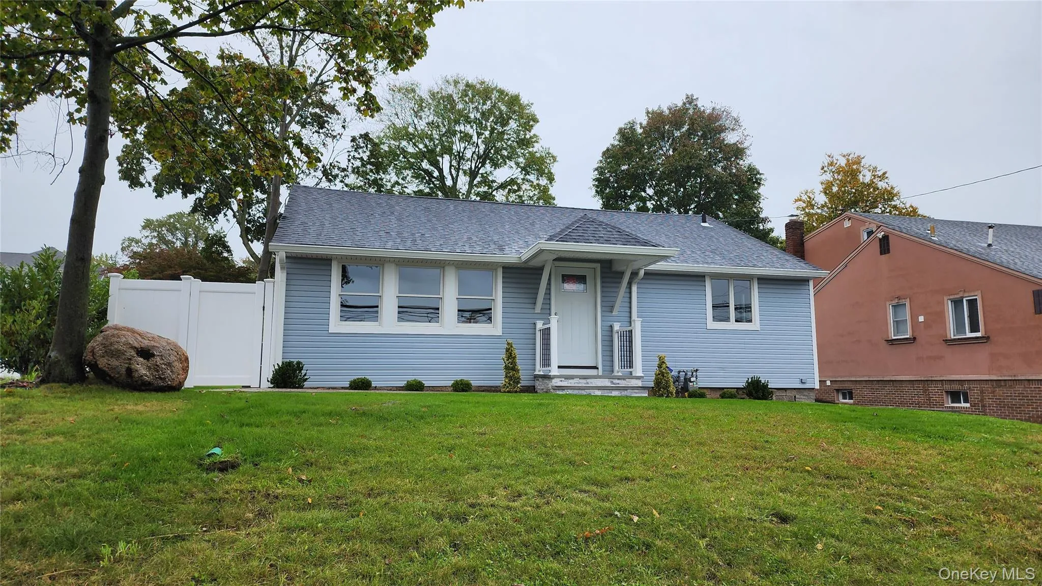 View of front of house with a shingled roof View of front of house with a shingled roof