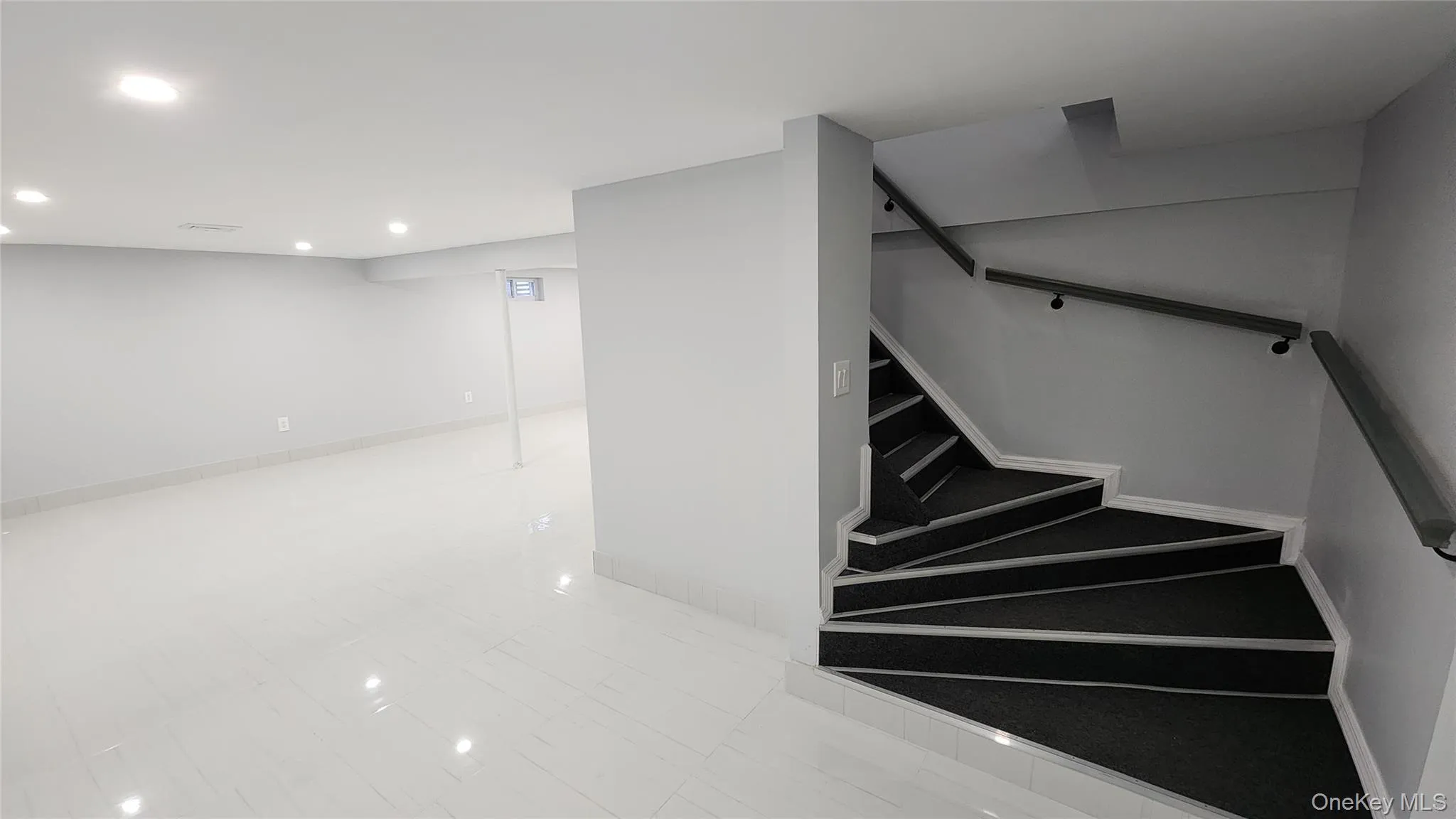 Stairway with recessed lighting and baseboards Stairway with recessed lighting and baseboards
