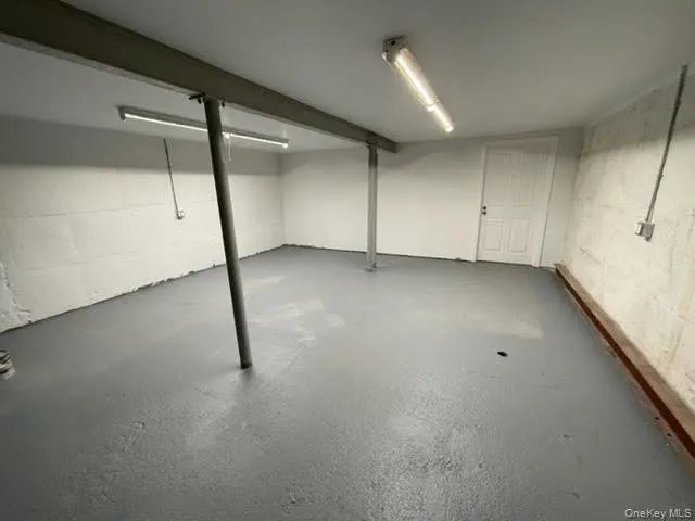 Finished basement with concrete block wall Finished basement with concrete block wall