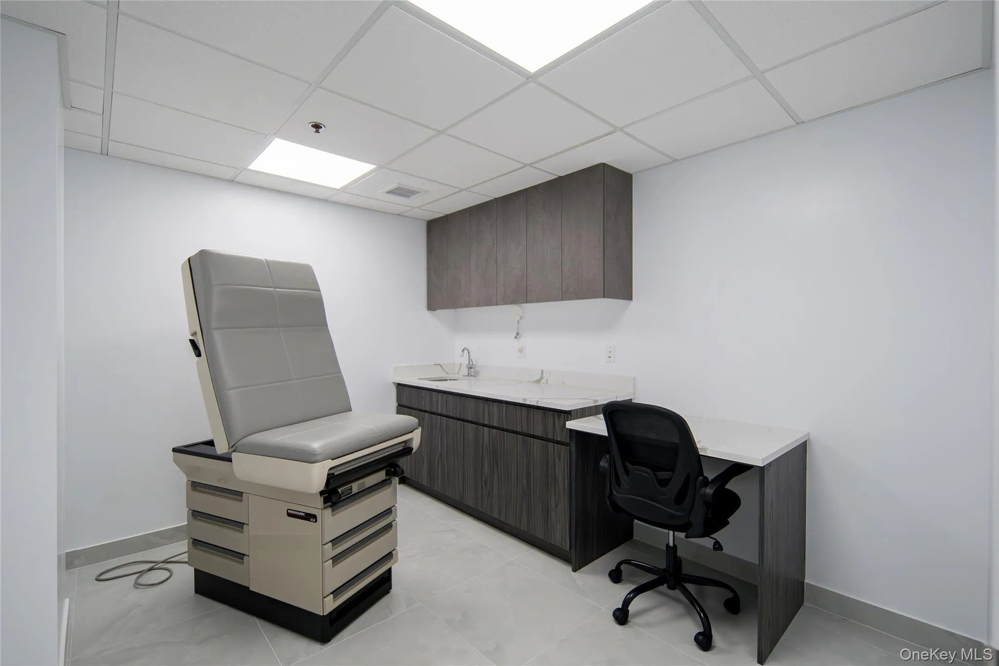 Office featuring a paneled ceiling and baseboards Office featuring a paneled ceiling and baseboards
