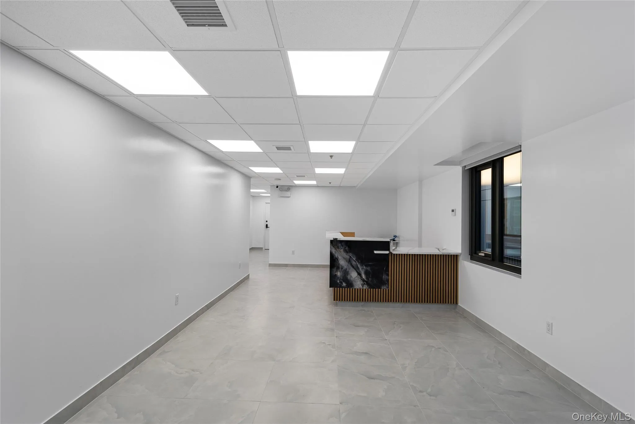Bar area with a drop ceiling and light countertops Bar area with a drop ceiling and light countertops