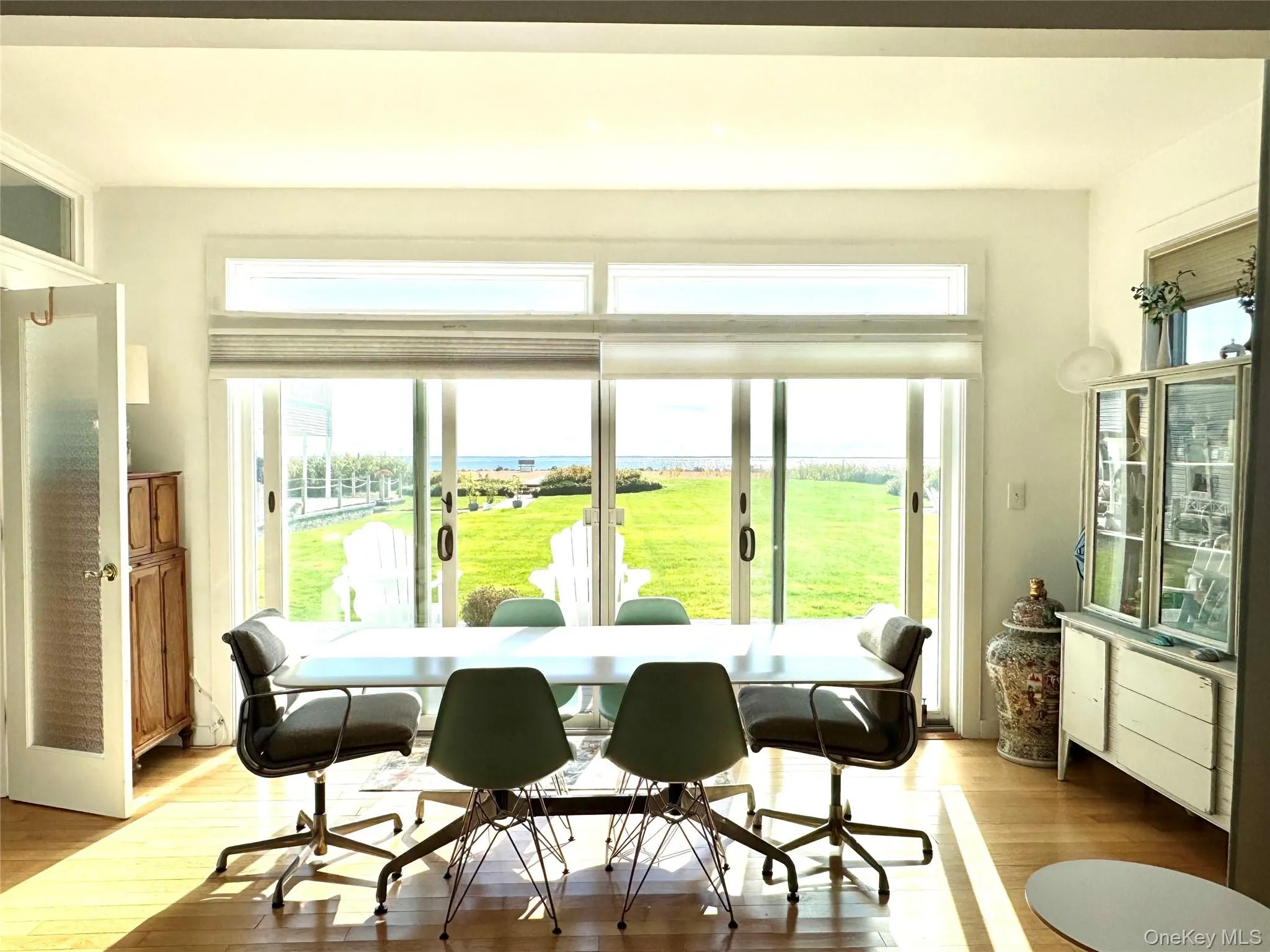 Dining area with light wood-style floors Dining area with light wood-style floors