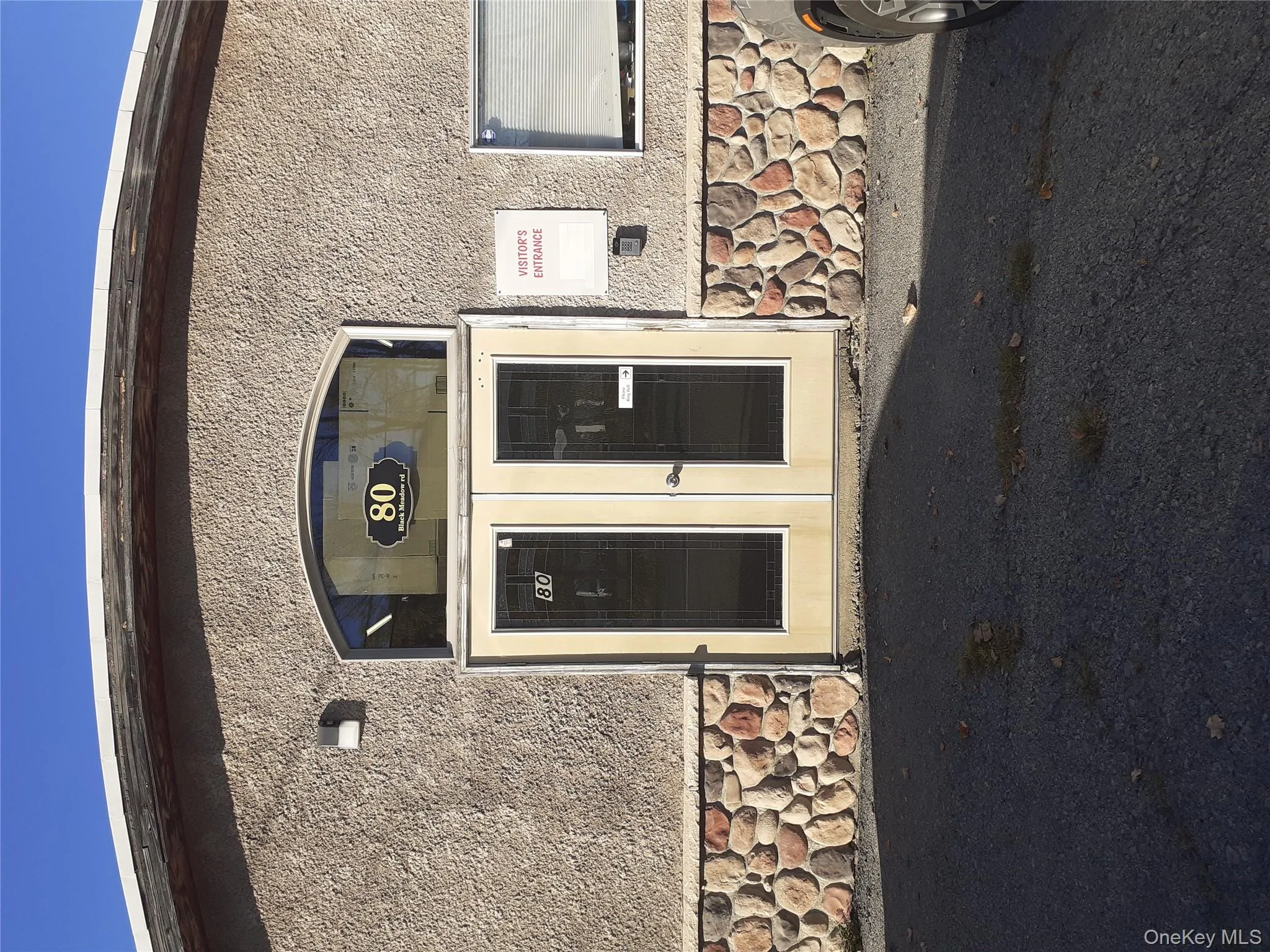Property entrance featuring stone siding and french doors Property entrance featuring stone siding and french doors