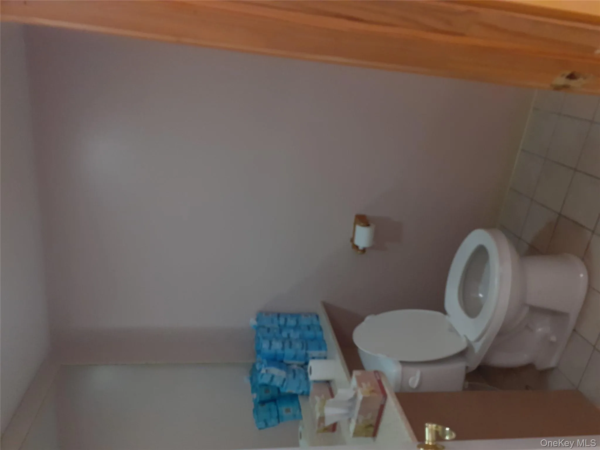 Bathroom with light tile patterned flooring and vanity Bathroom with light tile patterned flooring and vanity