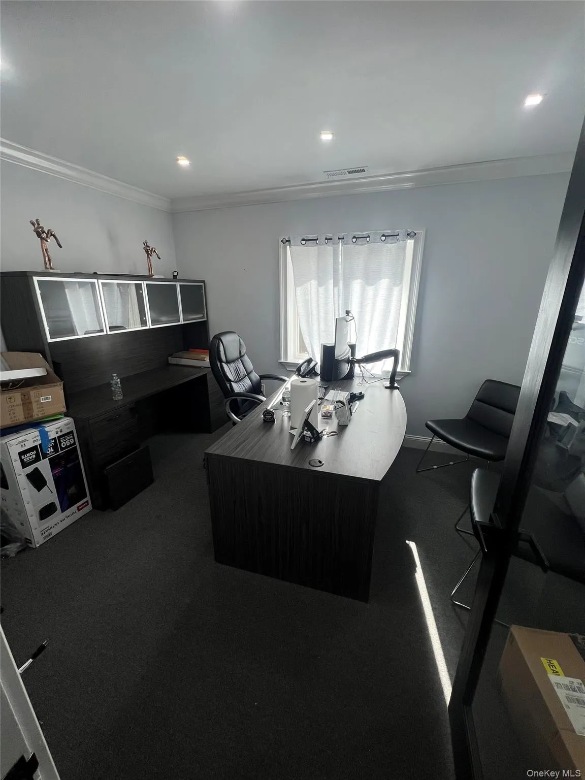 Office space with crown molding and recessed lighting Office space with crown molding and recessed lighting