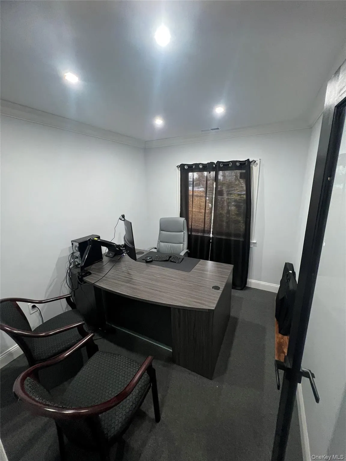 Office featuring ornamental molding, recessed lighting, and dark colored carpet Office featuring ornamental molding, recessed lighting, and dark colored carpet