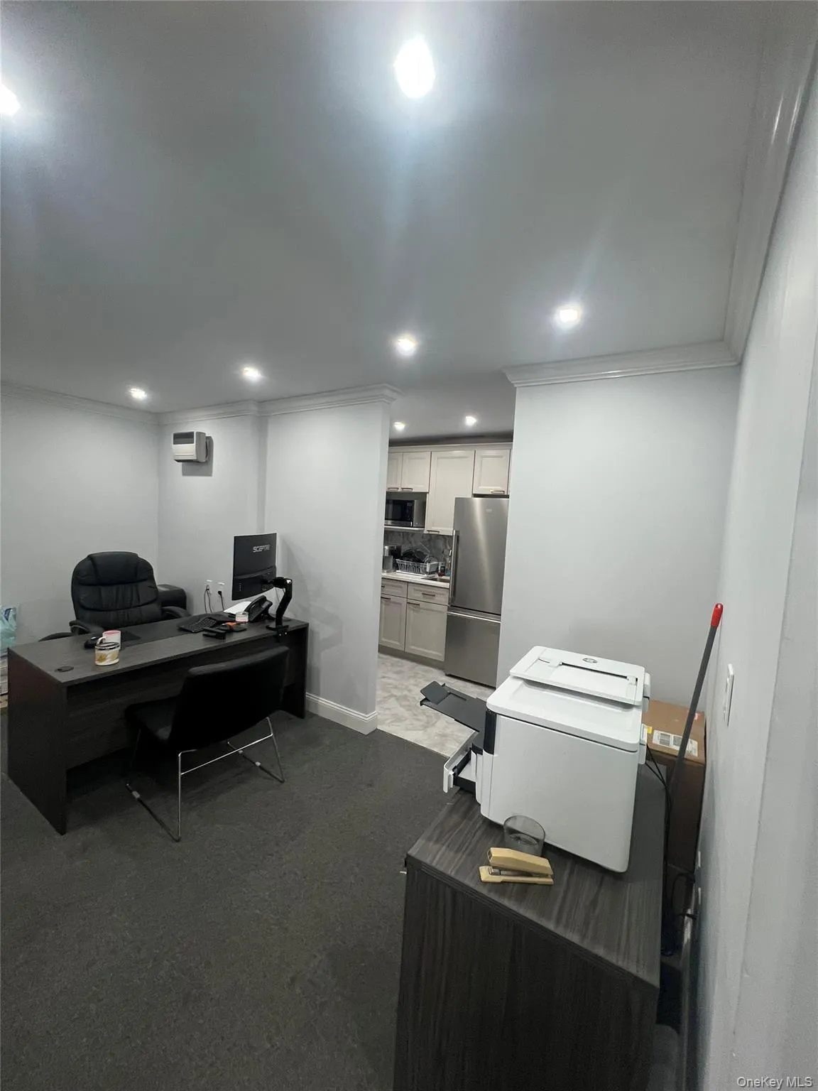 Home office featuring ornamental molding, dark colored carpet, and recessed lighting Home office featuring ornamental molding, dark colored carpet, and recessed lighting