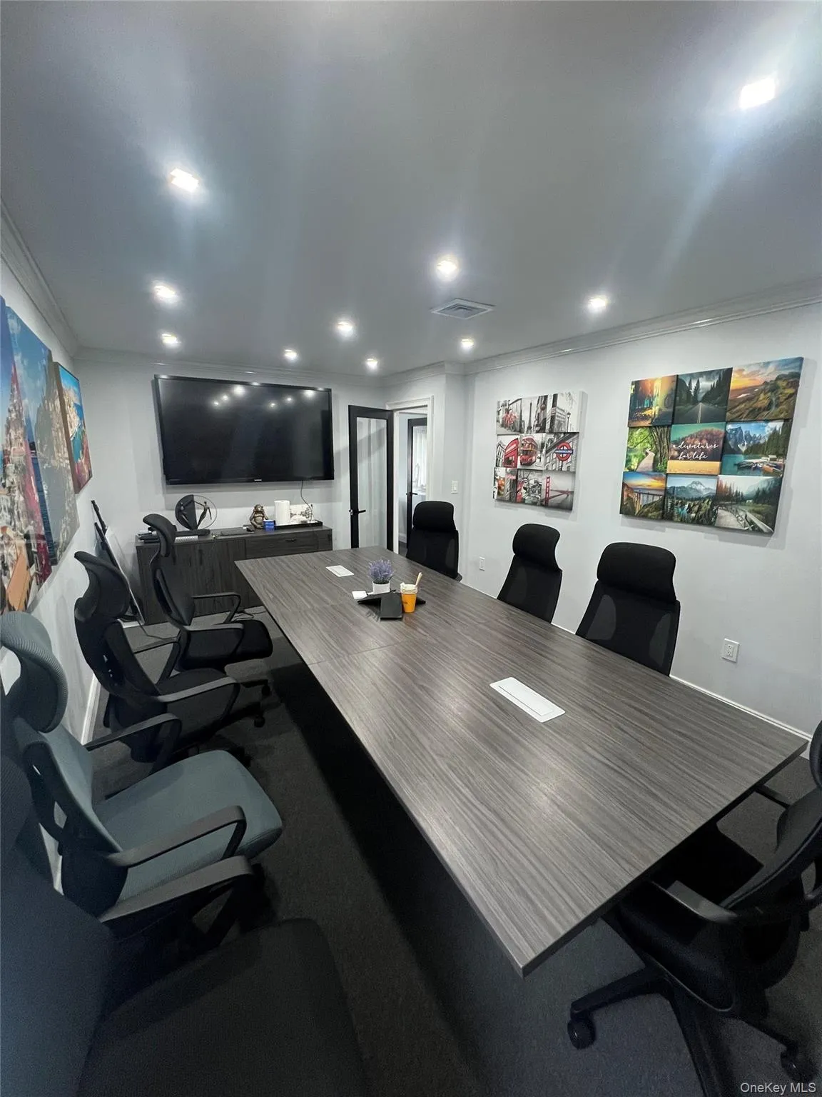 Featuring ornamental molding and recessed lighting Featuring ornamental molding and recessed lighting