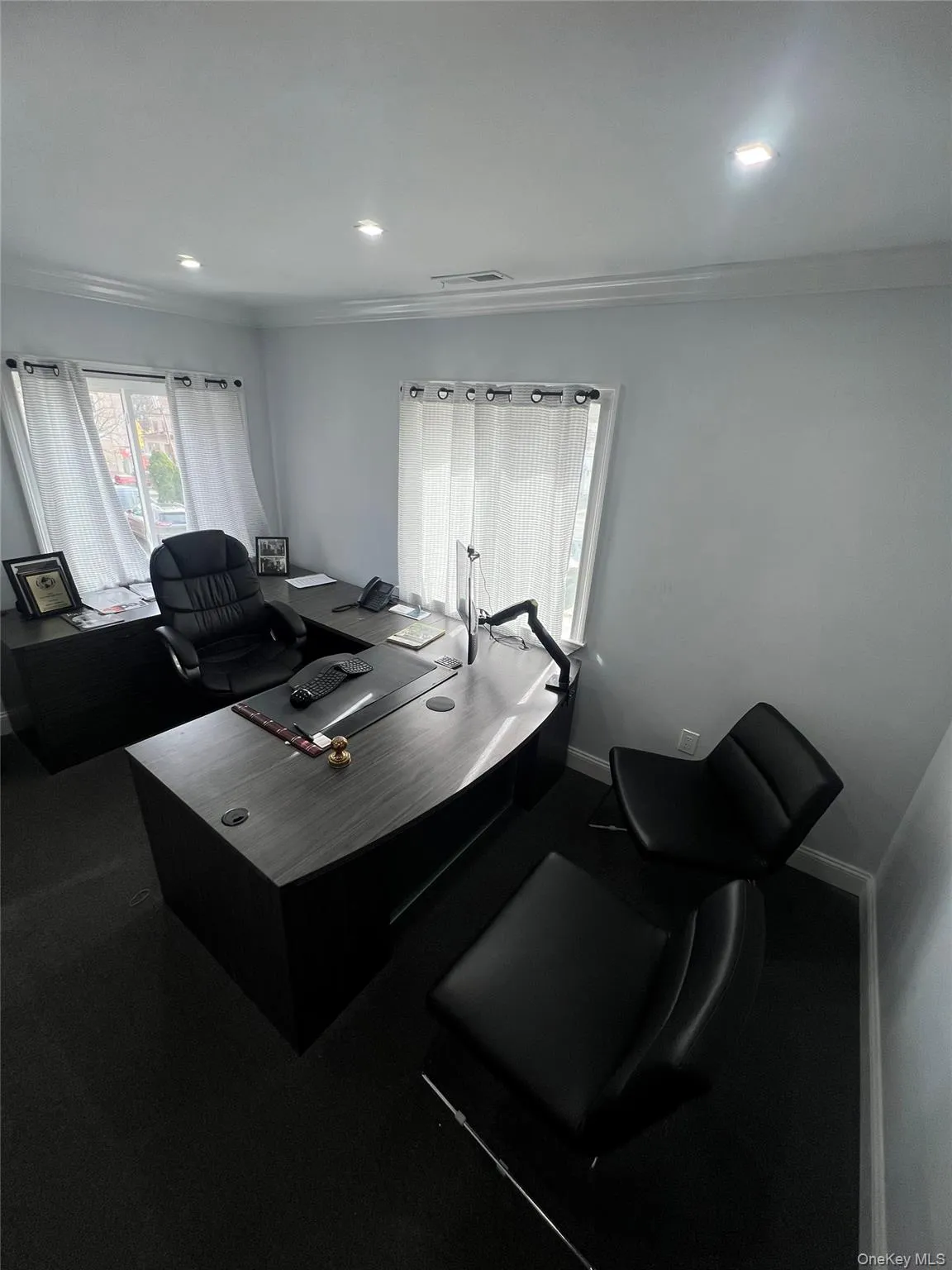 Office area with crown molding and recessed lighting Office area with crown molding and recessed lighting