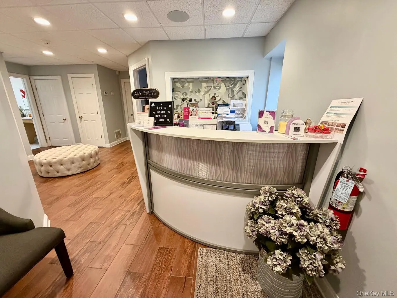 Welcome area with a paneled ceiling and recessed lighting Welcome area with a paneled ceiling and recessed lighting