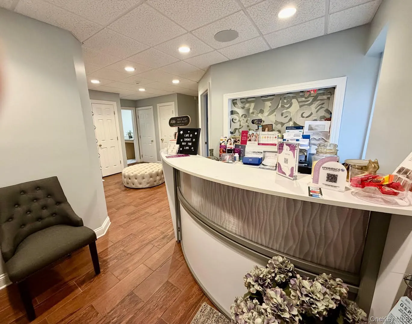 Reception area with a paneled ceiling and recessed lighting Reception area with a paneled ceiling and recessed lighting