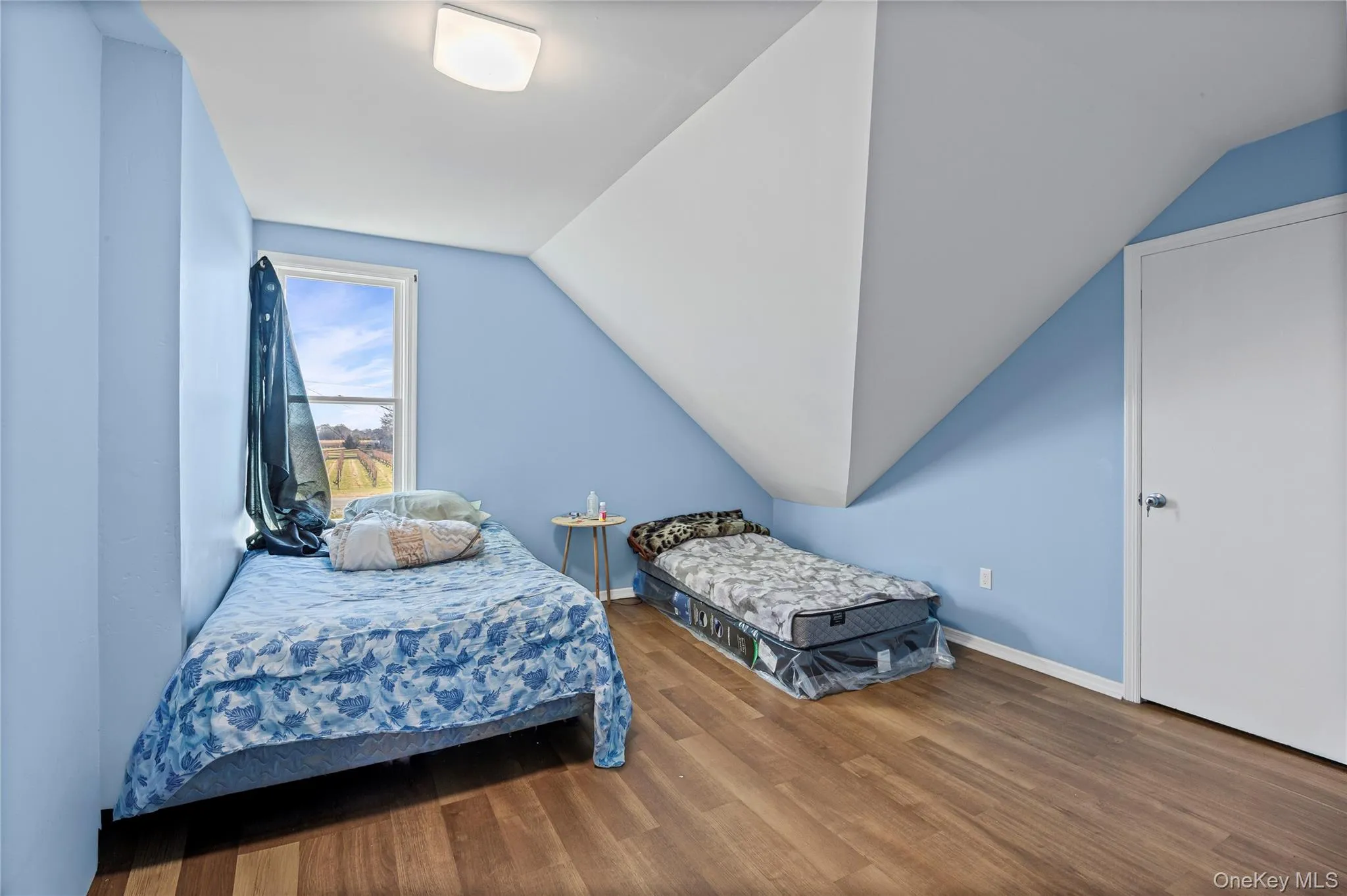 Bedroom featuring vaulted ceiling Bedroom featuring vaulted ceiling