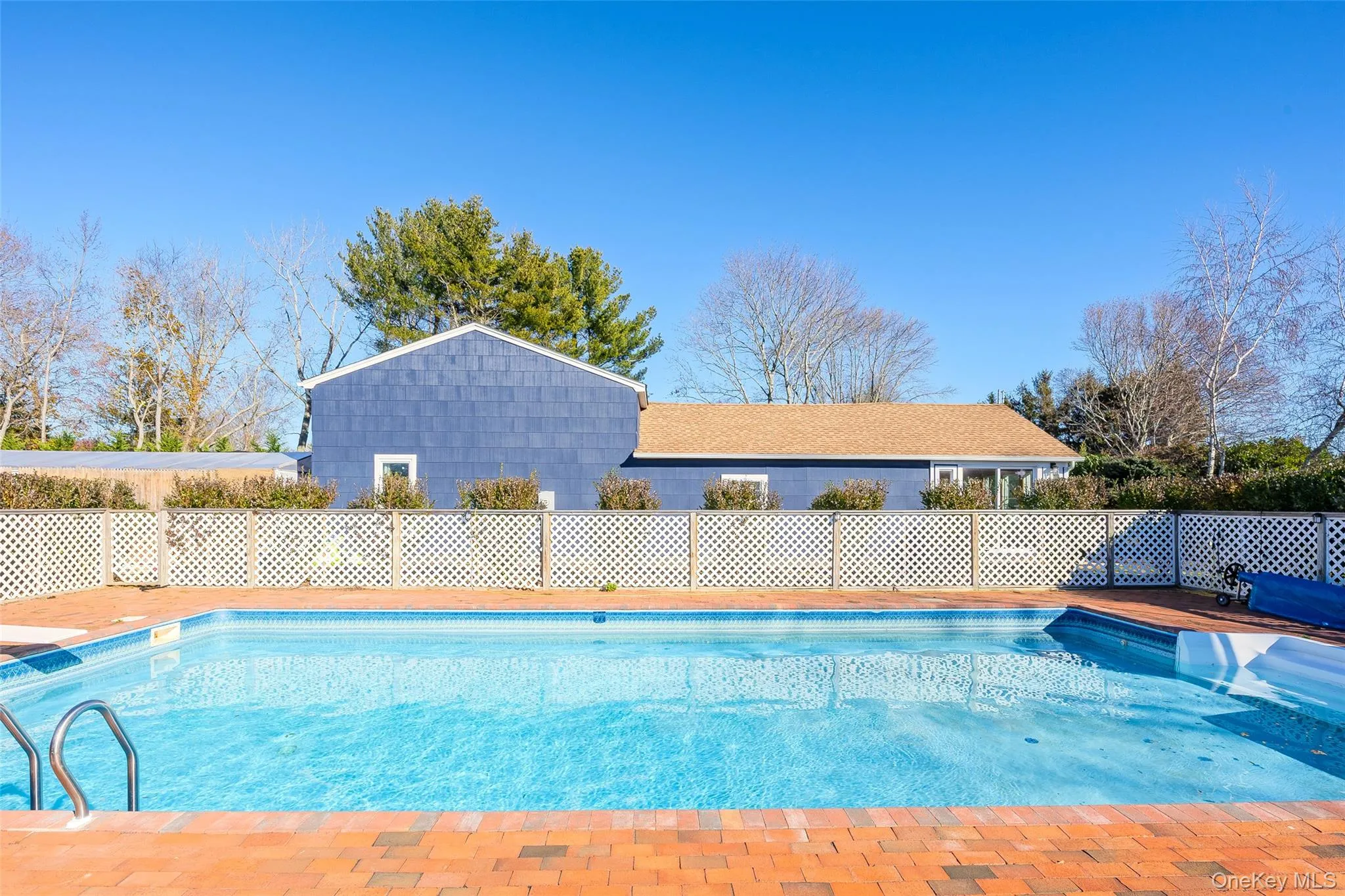 View of pool with a patio View of pool with a patio
